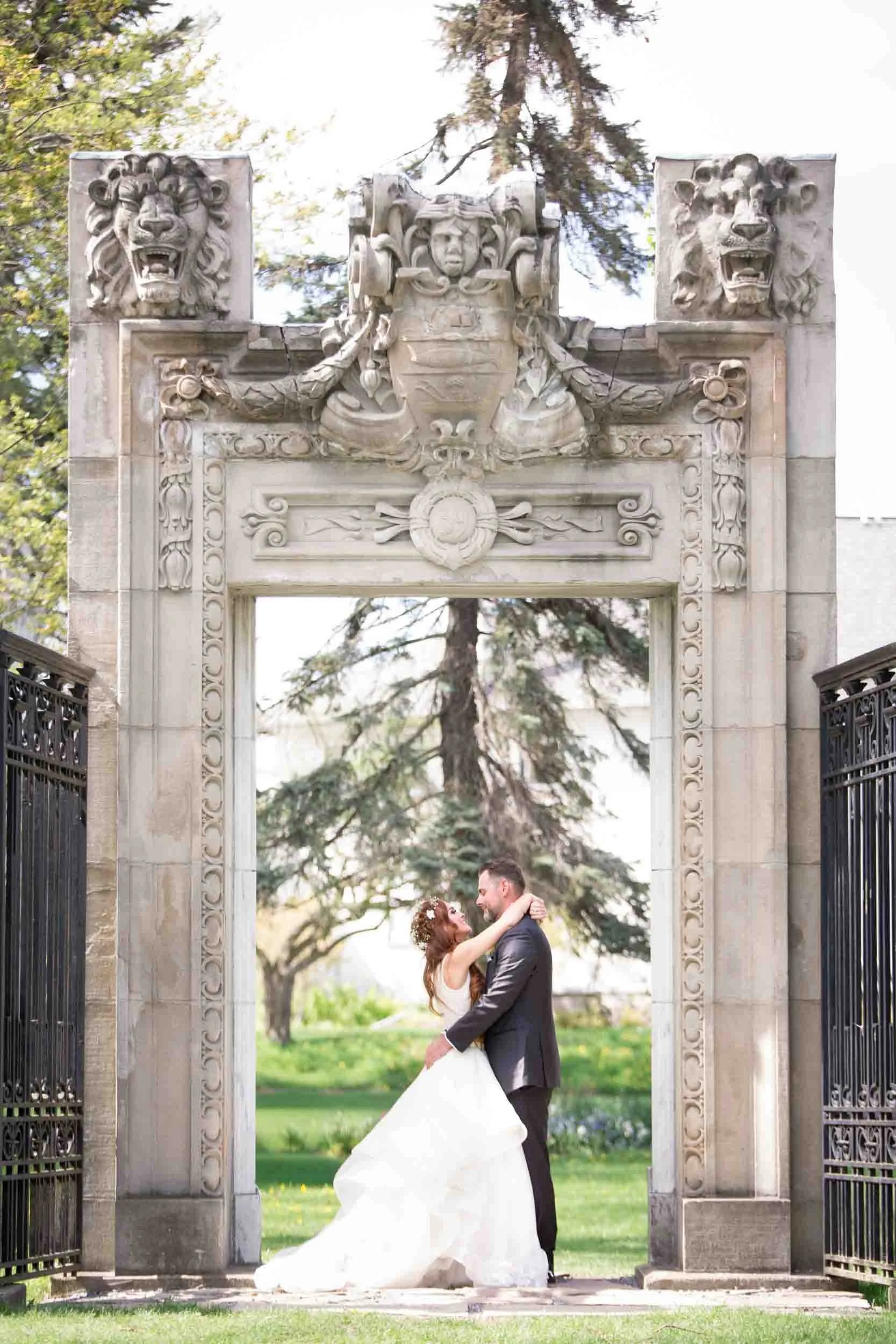 Romantic portrait framed by Guild Inn Estate stone gate