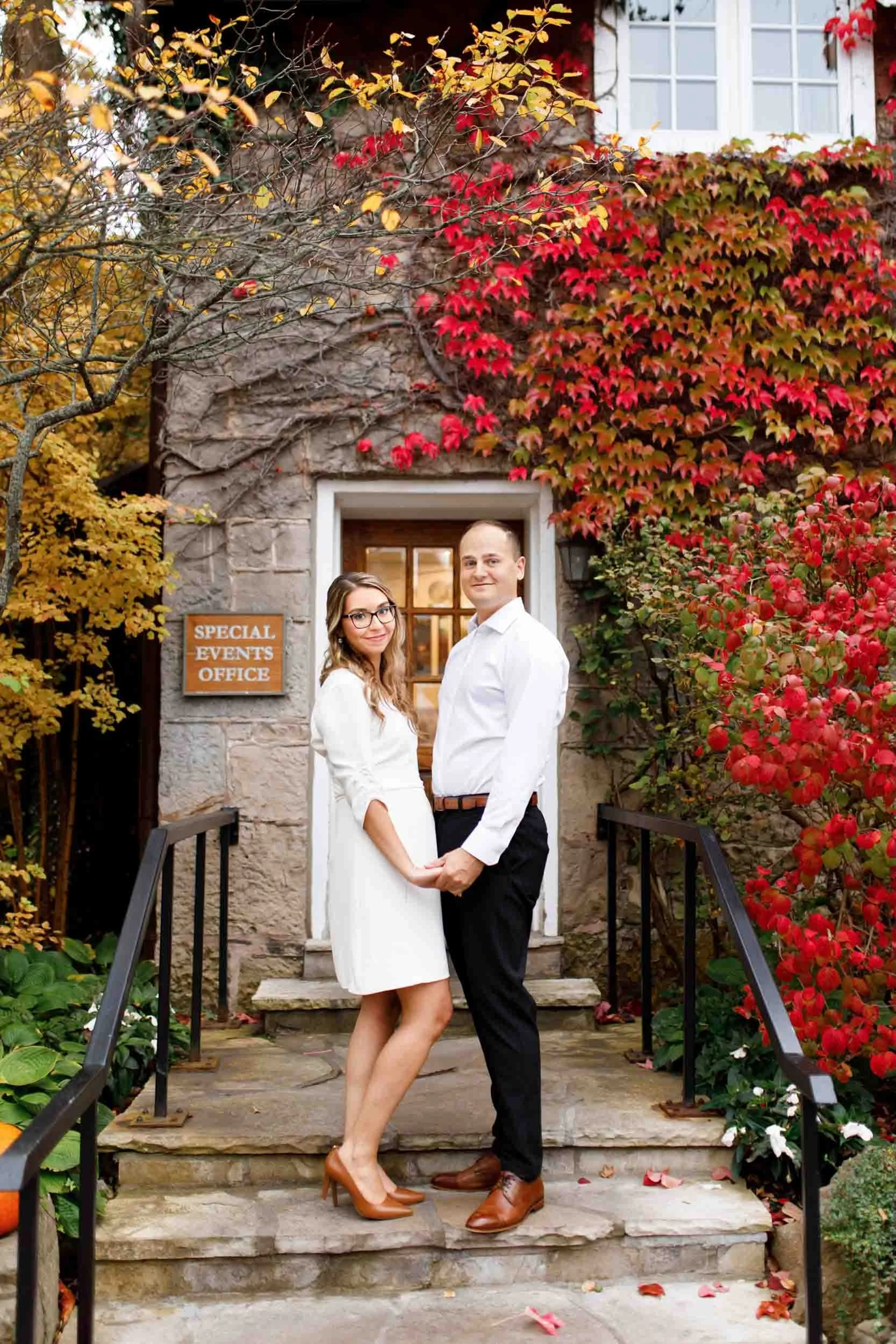 Engagement portrait at the Ancaster Mill ivy-covered stone entrance in Ancaster
