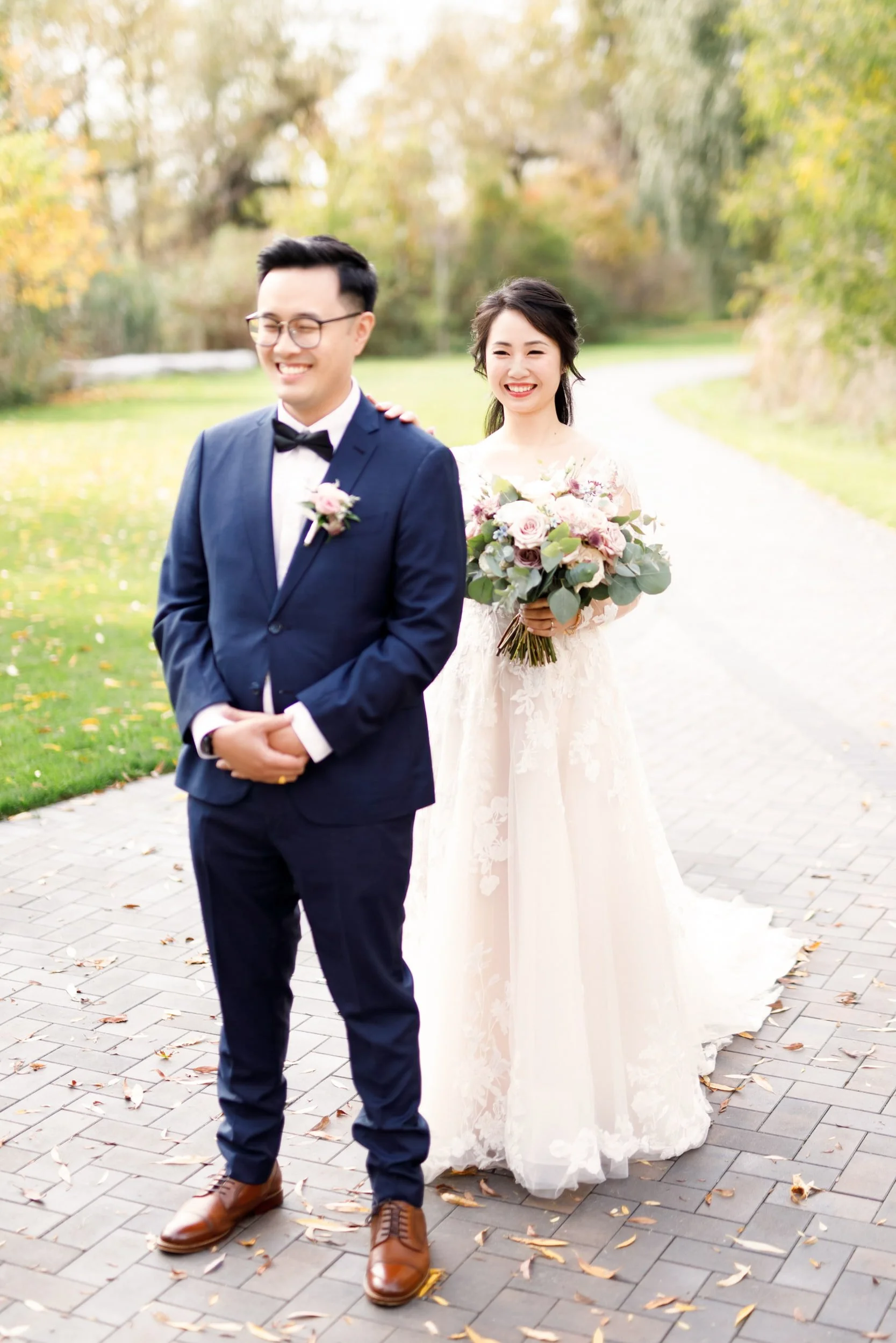 Bride and groom portrait along the garden path at the Arlington Estate in Vaughan
