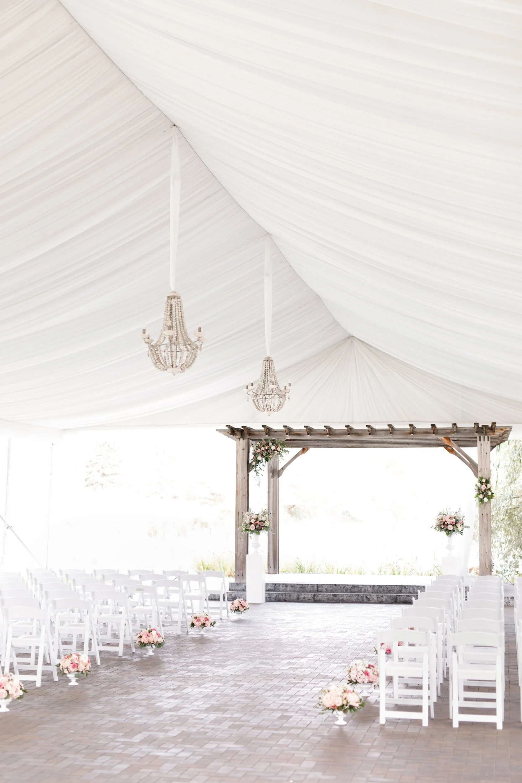 Outdoor wedding ceremony setup beneath the white pavilion at the Arlington Estate in Vaughan