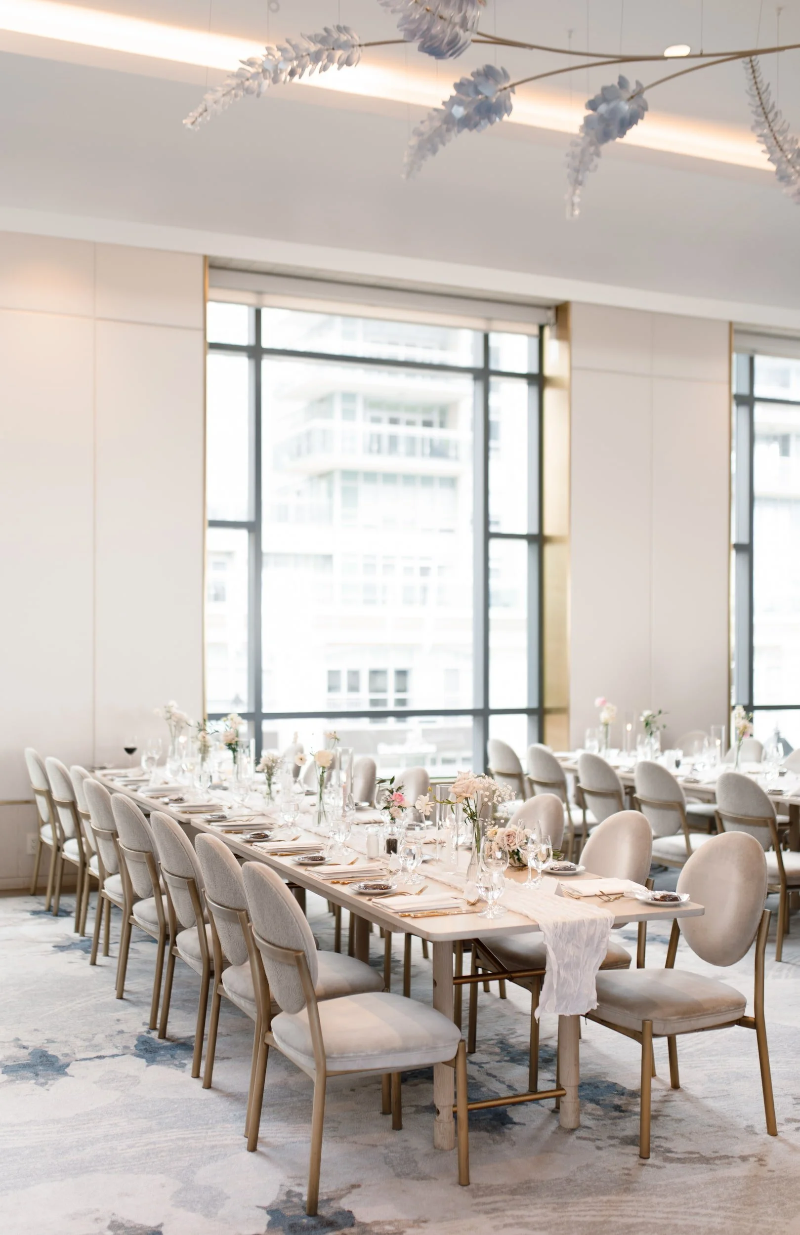 Reception space with floor-to-ceiling windows at The Pearle Hotel & Spa in Burlington, Ontario