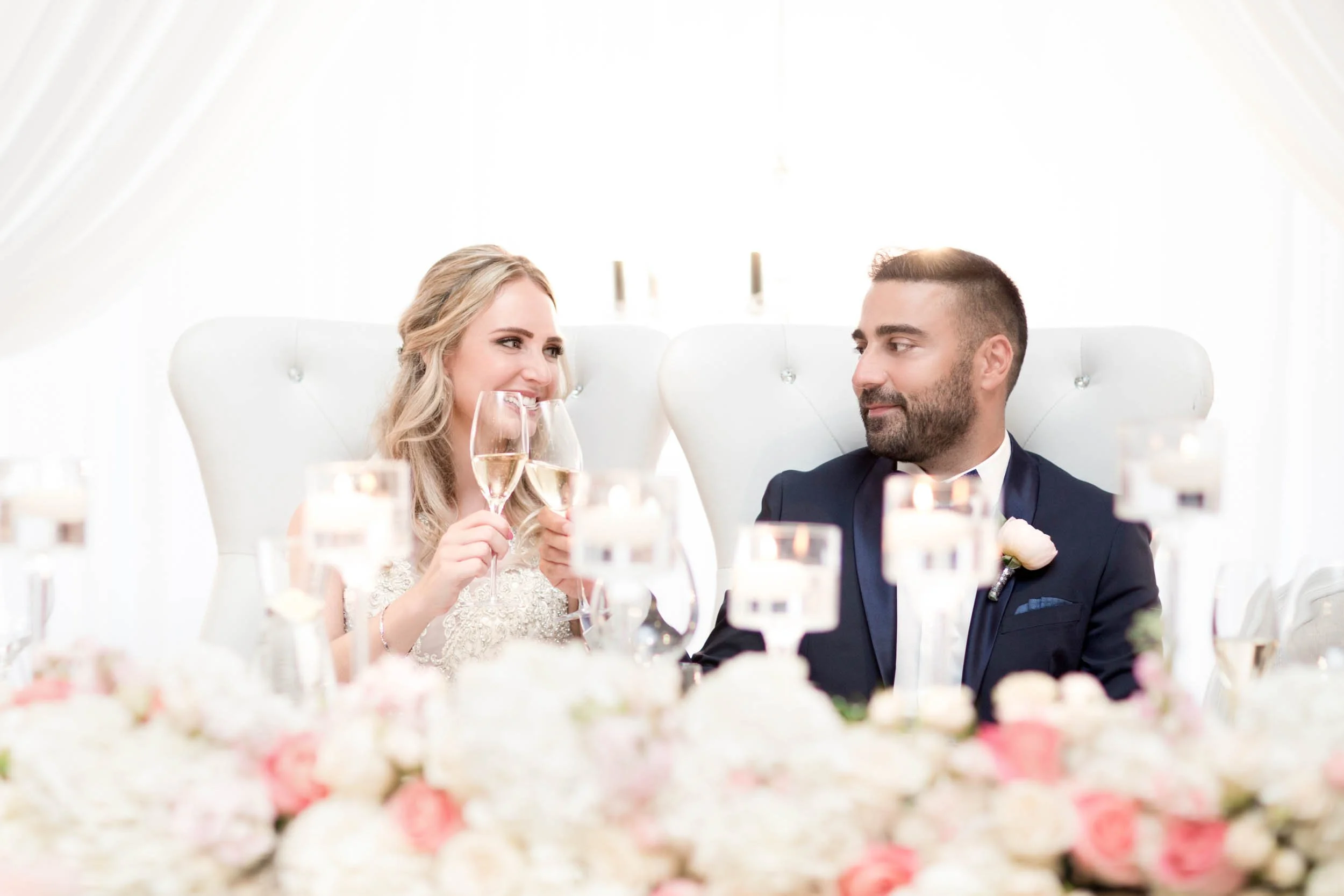 Bride and groom toasting during their Arlington Estate wedding reception in Vaughan