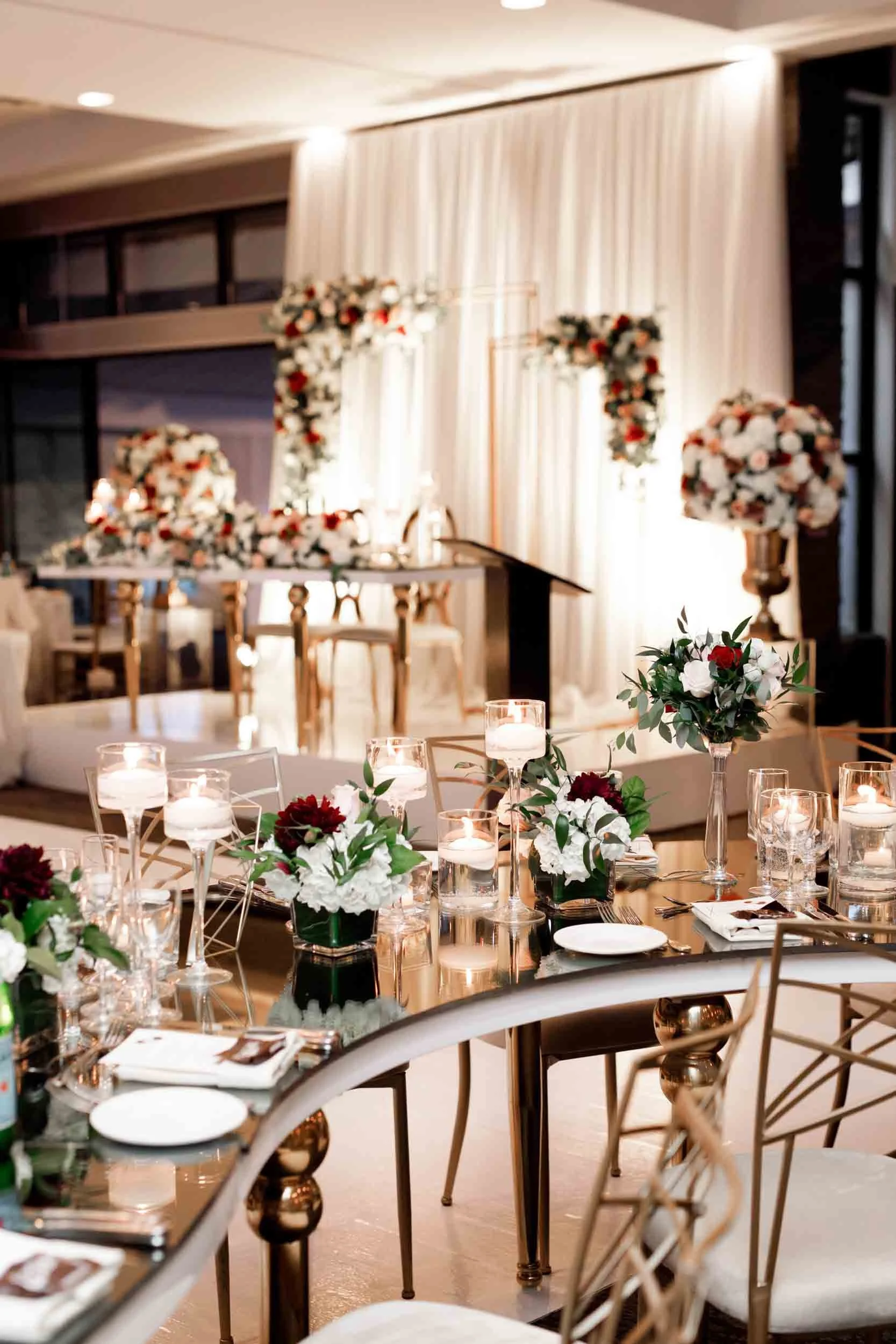 Reception table scape with gold accents and candlelight at The Manor Event Venue wedding in King, Ontario