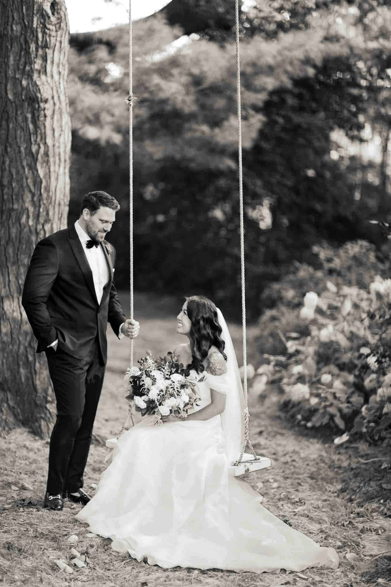 Romantic swing portrait beneath trees at Gracewood Estate