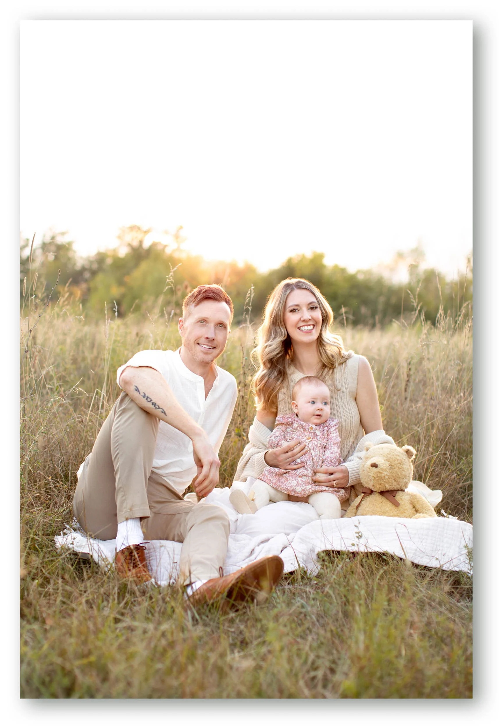 Daniel Clements with his wife and daughter during a family portrait at golden hour