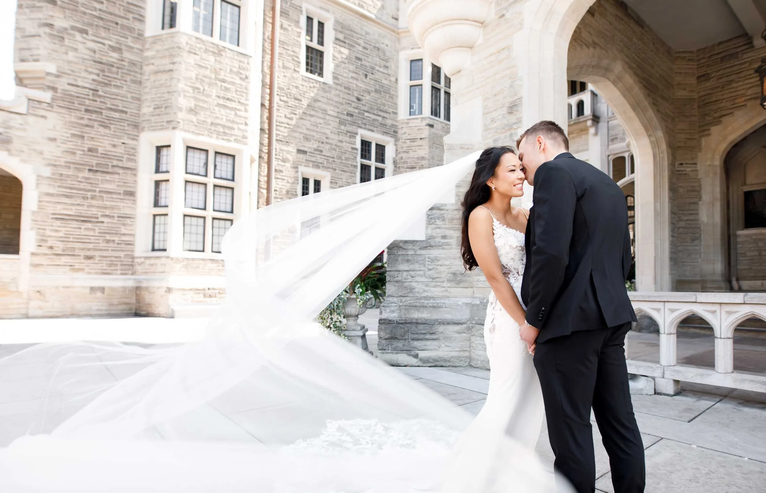Romantic flowing veil portrait on the grand stone staircase at Casa Loma