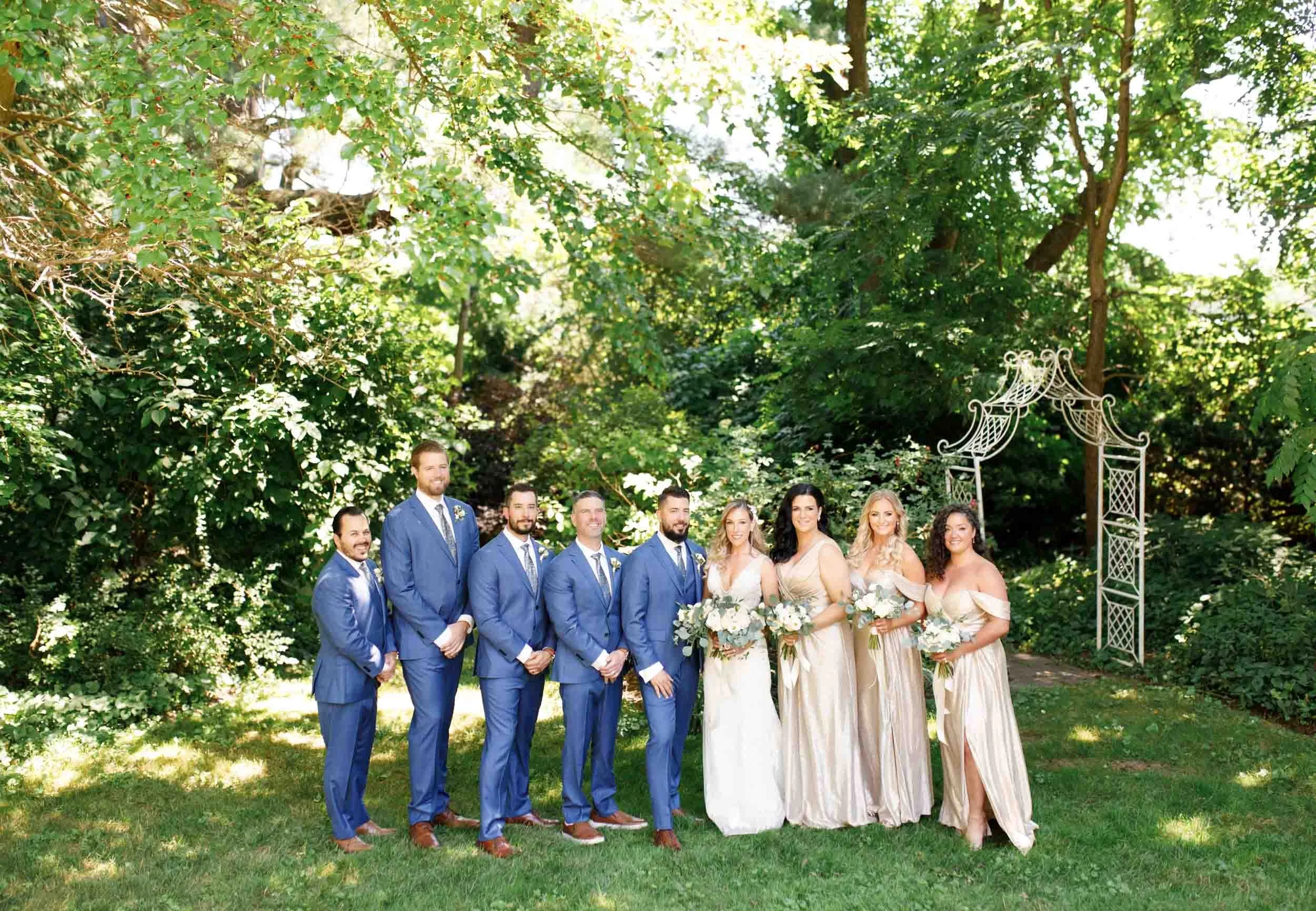 Wedding party portrait on lawn at Gracewood Estate in Niagara-on-the-Lake