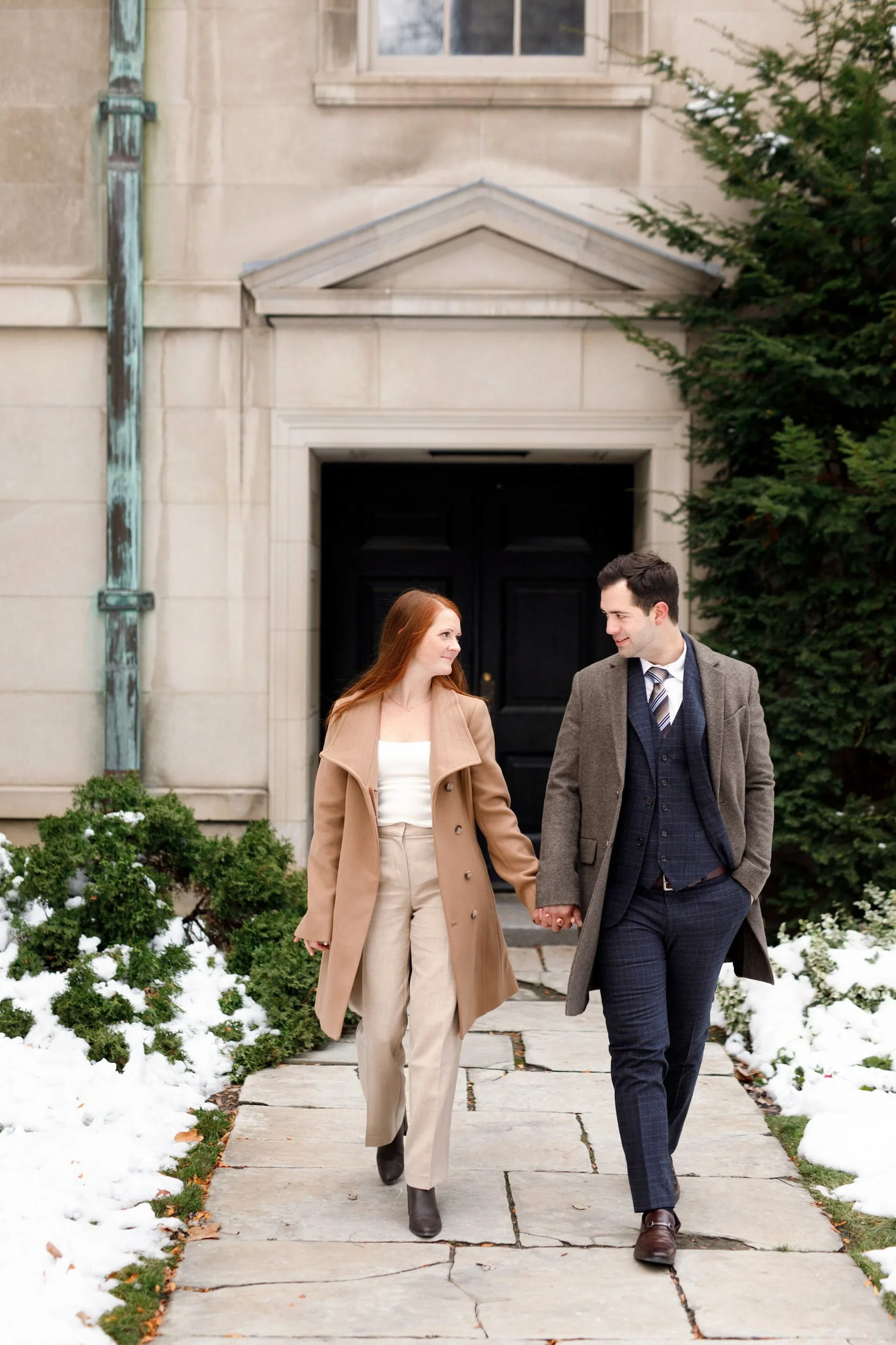 Winter engagement portrait at heritage doorway at Osgoode Hall