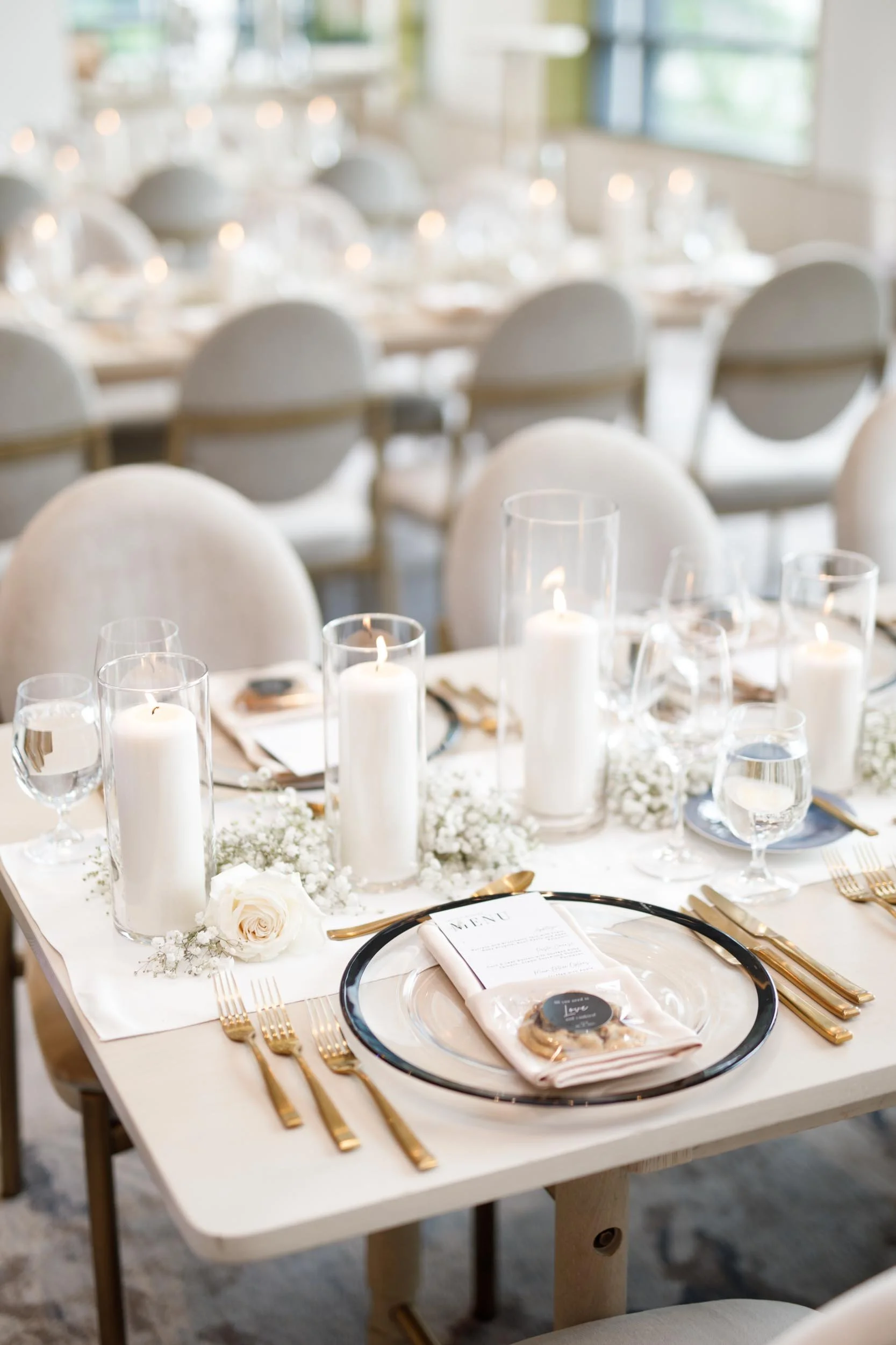 Wedding reception table setting with candles at The Pearle Hotel & Spa in Burlington, Ontario
