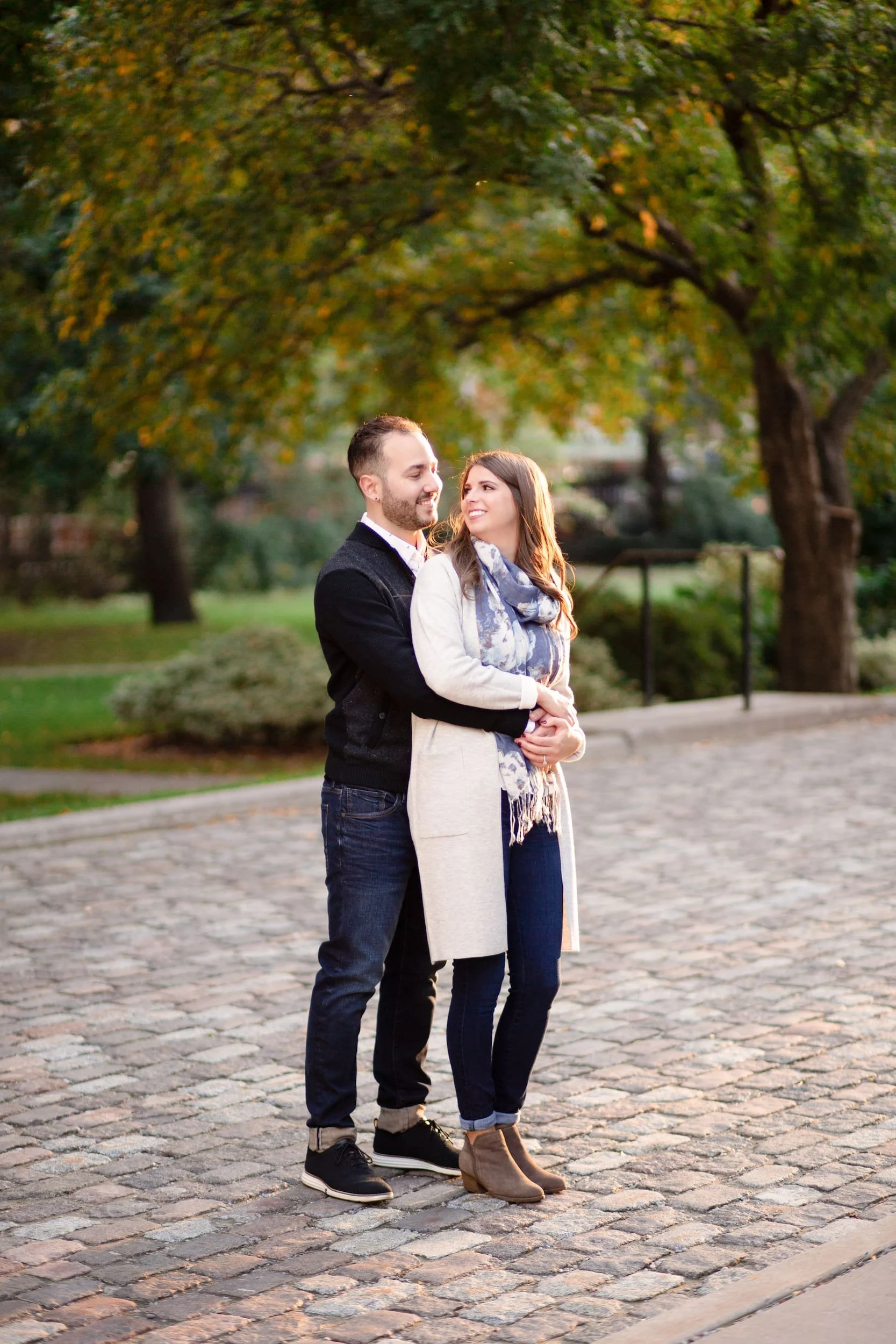 Engagement portrait on cobblestone courtyard at Osgoode Hall in downtown Toronto