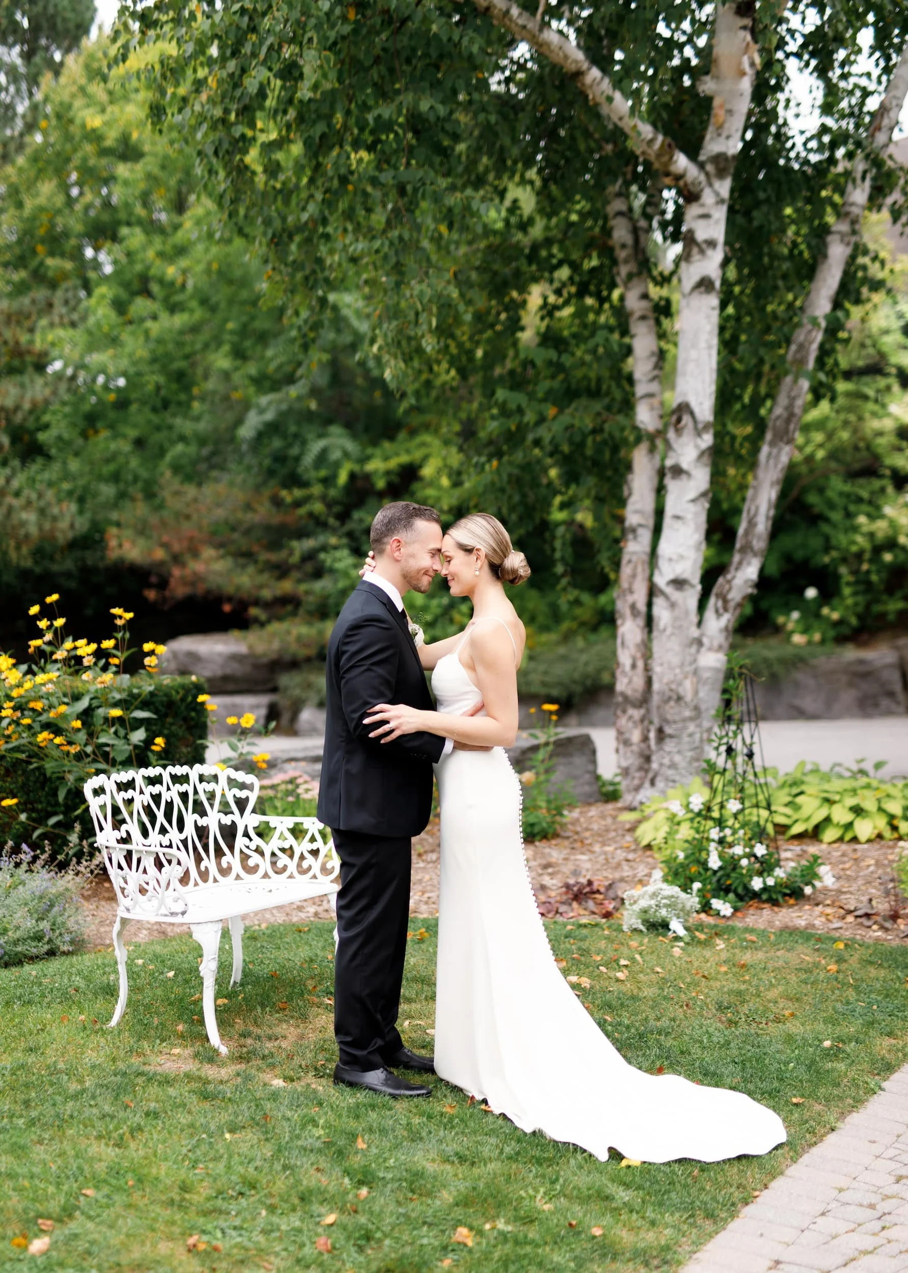 Romantic portrait beside garden bench at The Manor Event Venue wedding in King, Ontario