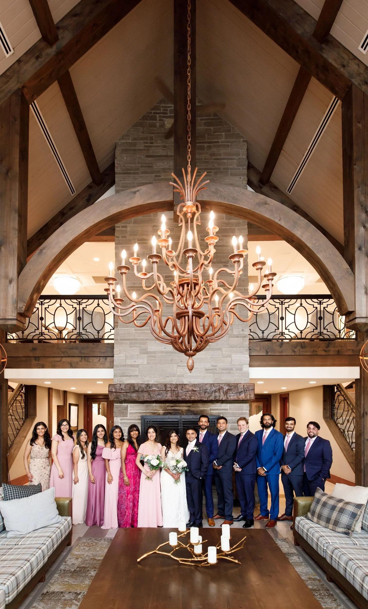 Wedding party beneath grand chandelier in clubhouse at Whistle Bear Golf Club, Cambridge, Ontario