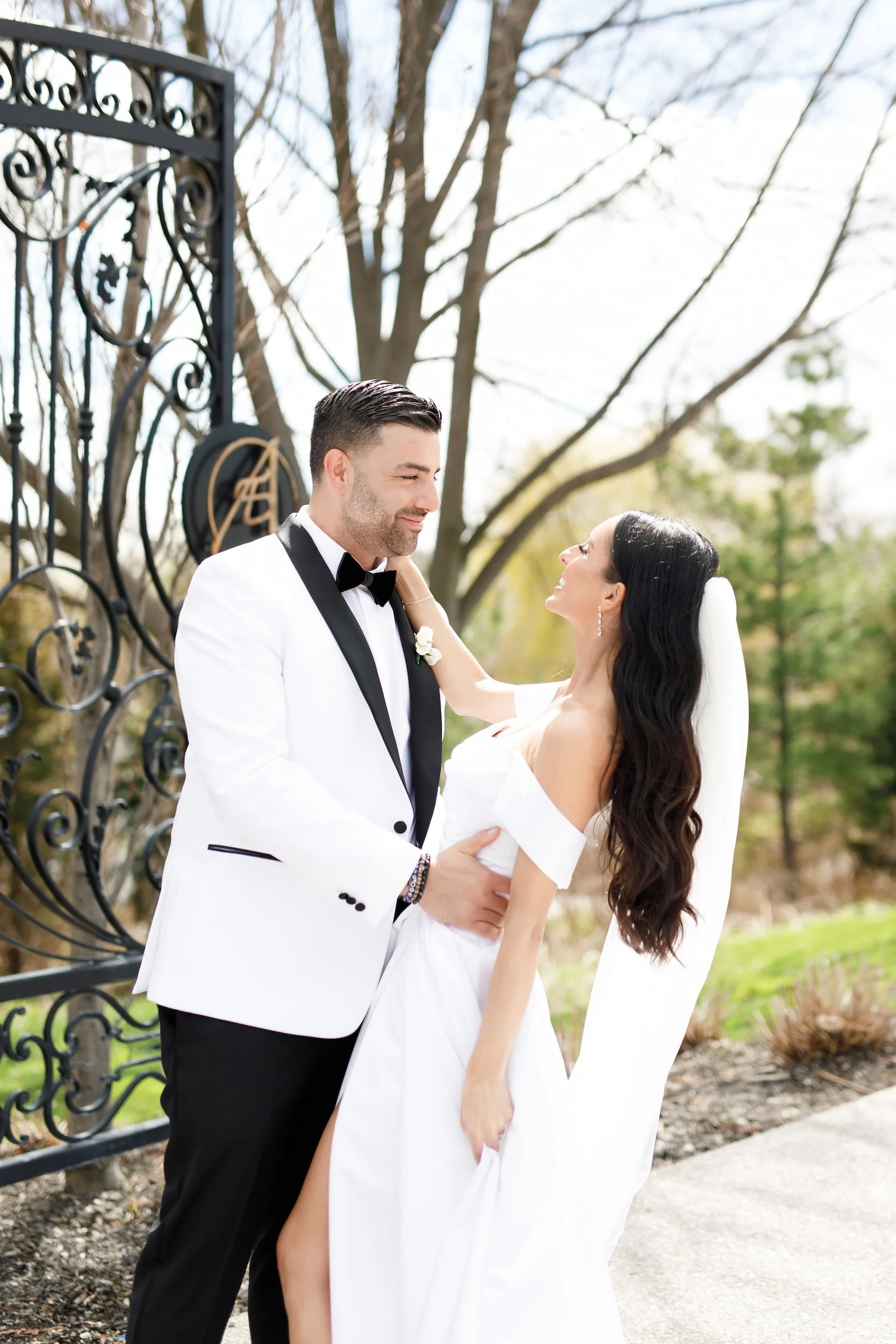 Bride and groom portrait at the Arlington Estate entrance gates in Vaughan