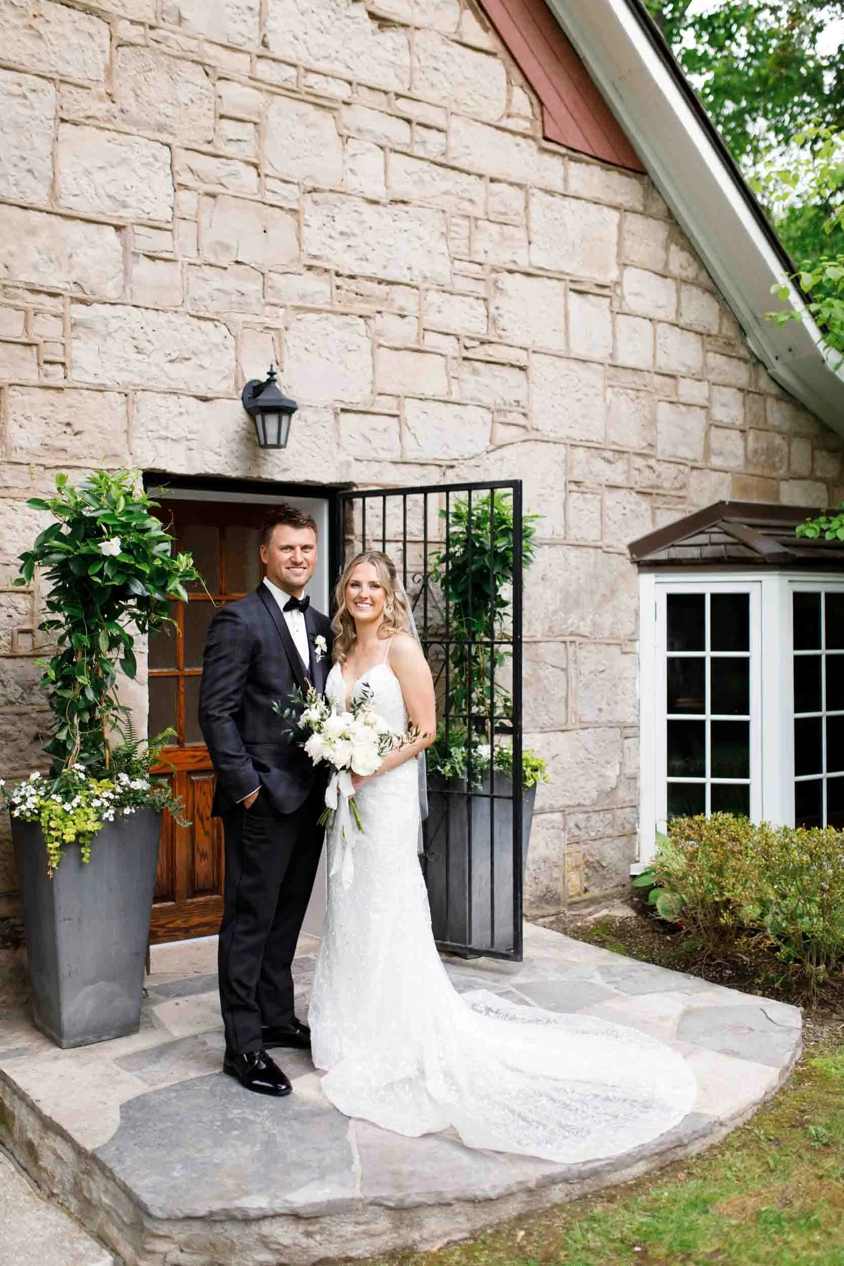 Bride and groom portrait at the Ancaster Mill stone entrance in Ancaster