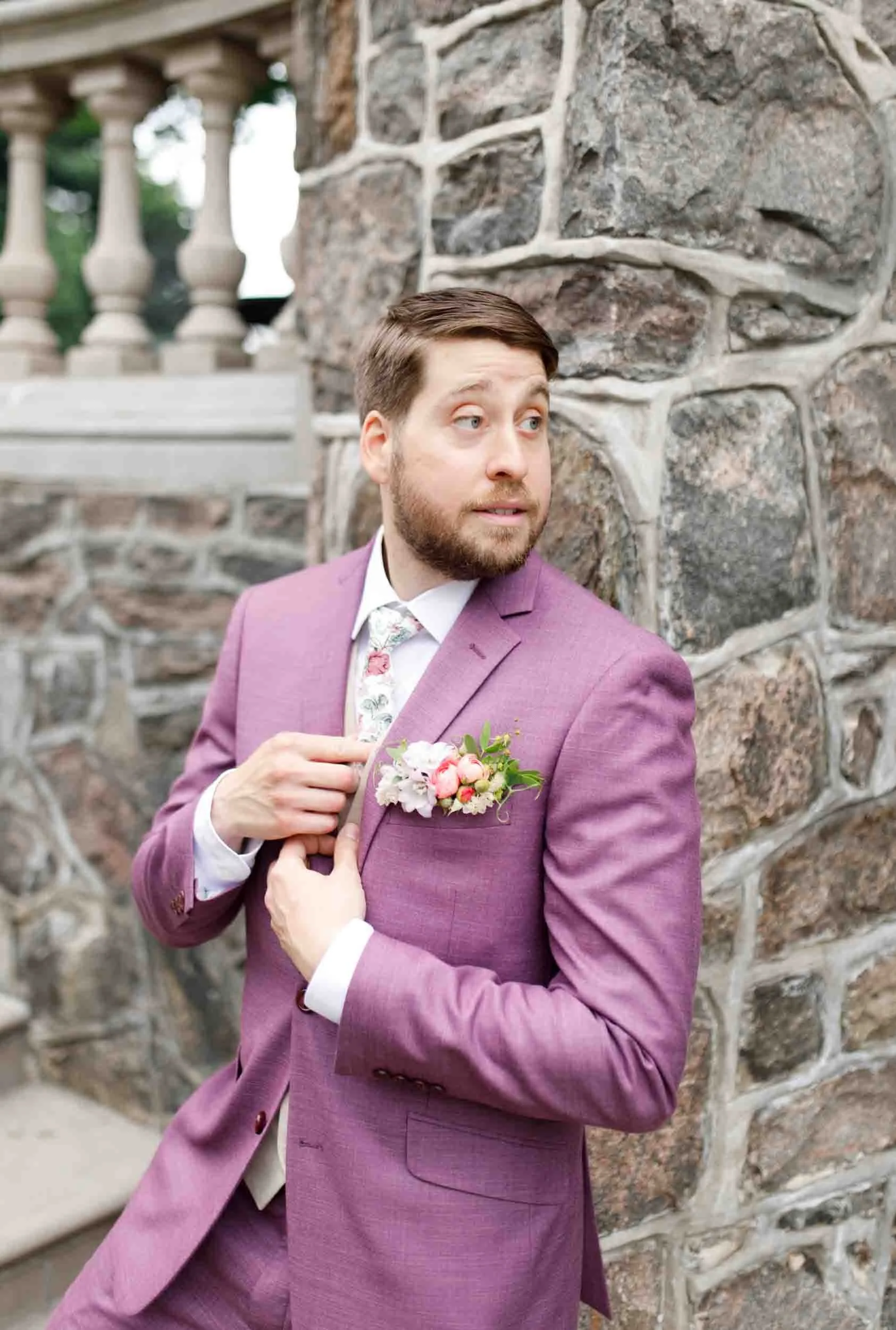 Groom adjusting boutonniere at Graydon Hall Manor