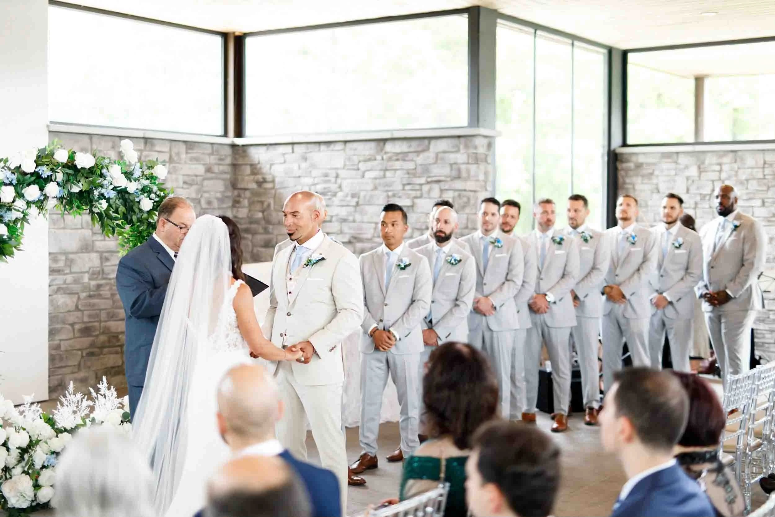 Indoor ceremony vows at Guild Inn Estate modern ballroom