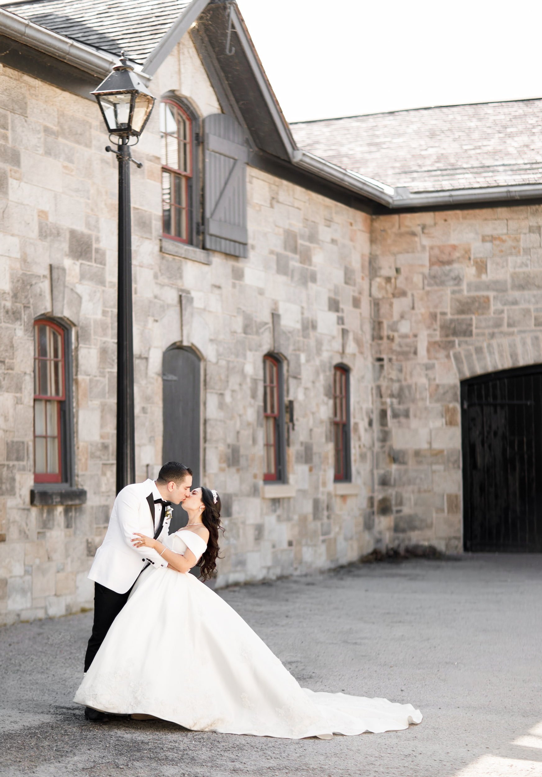 Bride and groom portrait at Dundurn Castle stone courtyard