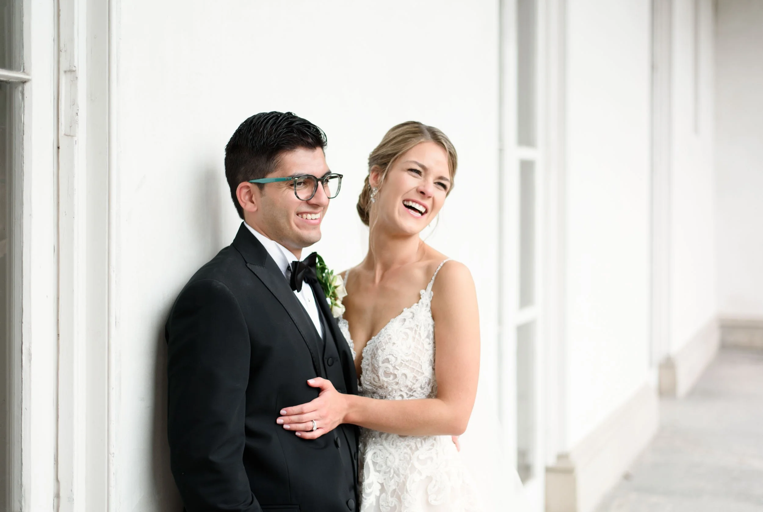 Bride and groom portrait against Dundurn Castle white exterior