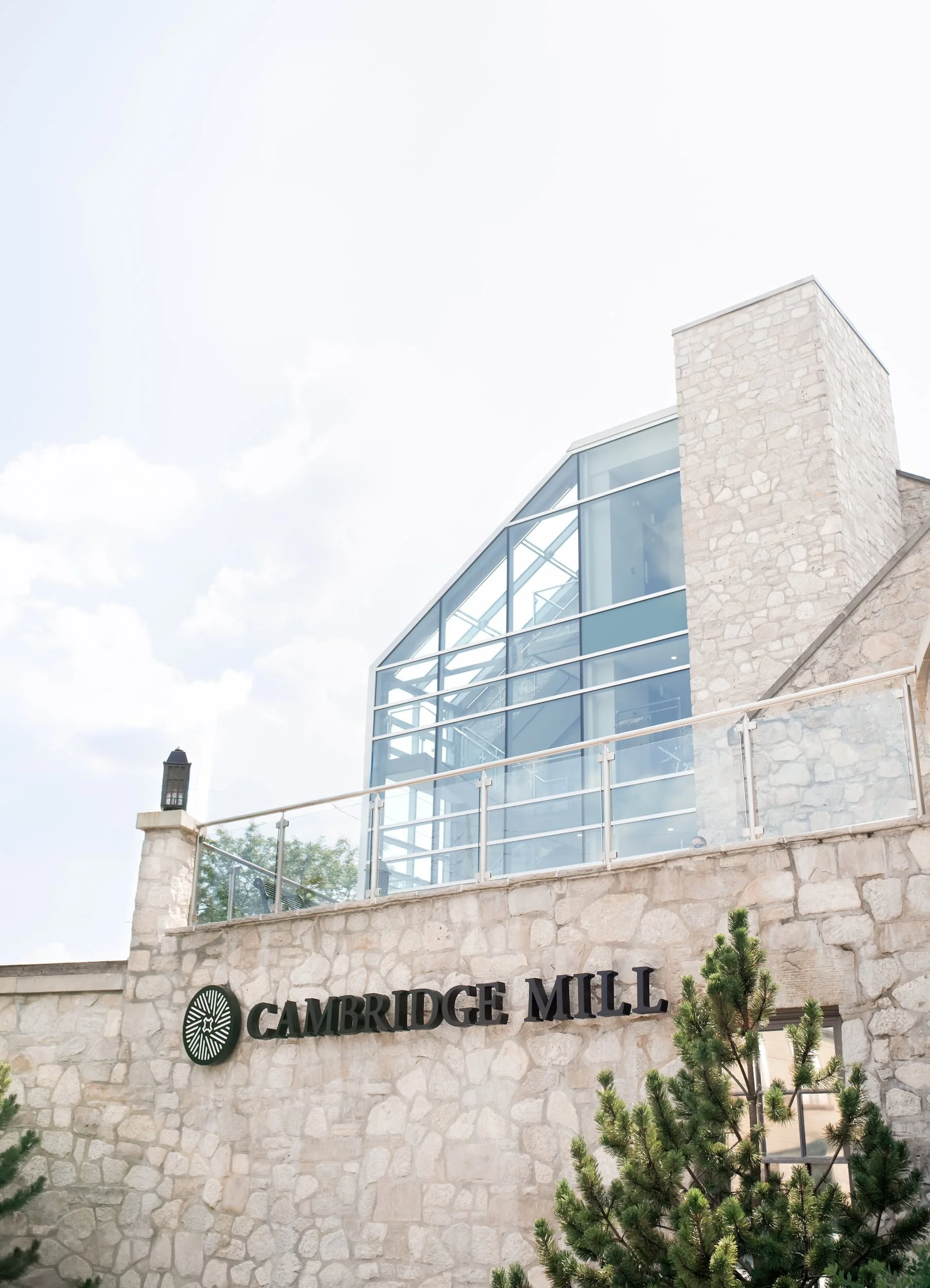 Exterior of Cambridge Mill wedding venue entrance sign in Cambridge, Ontario overlooking the Grand River
