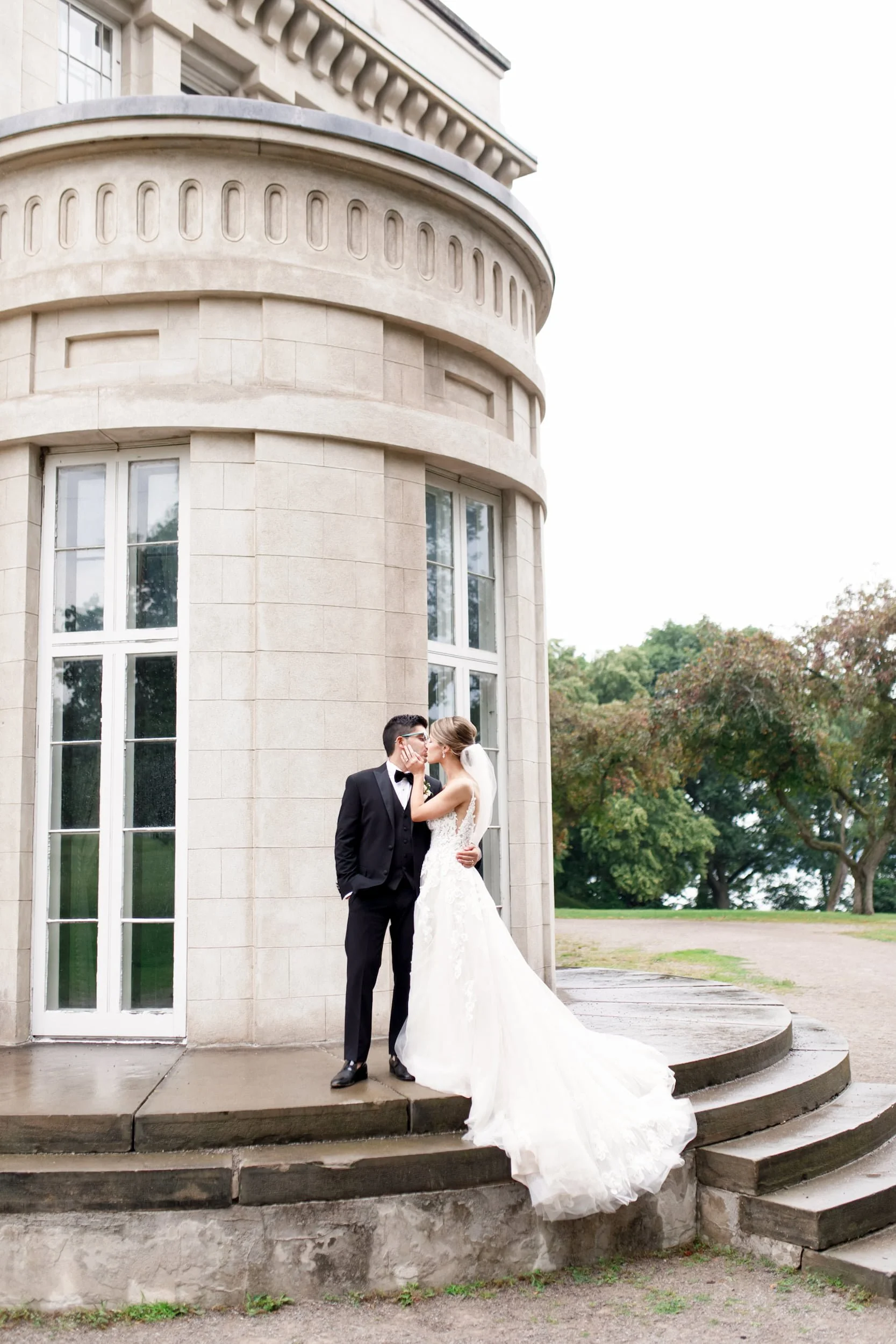 Bride and groom portrait beside Dundurn Castle rounded façade