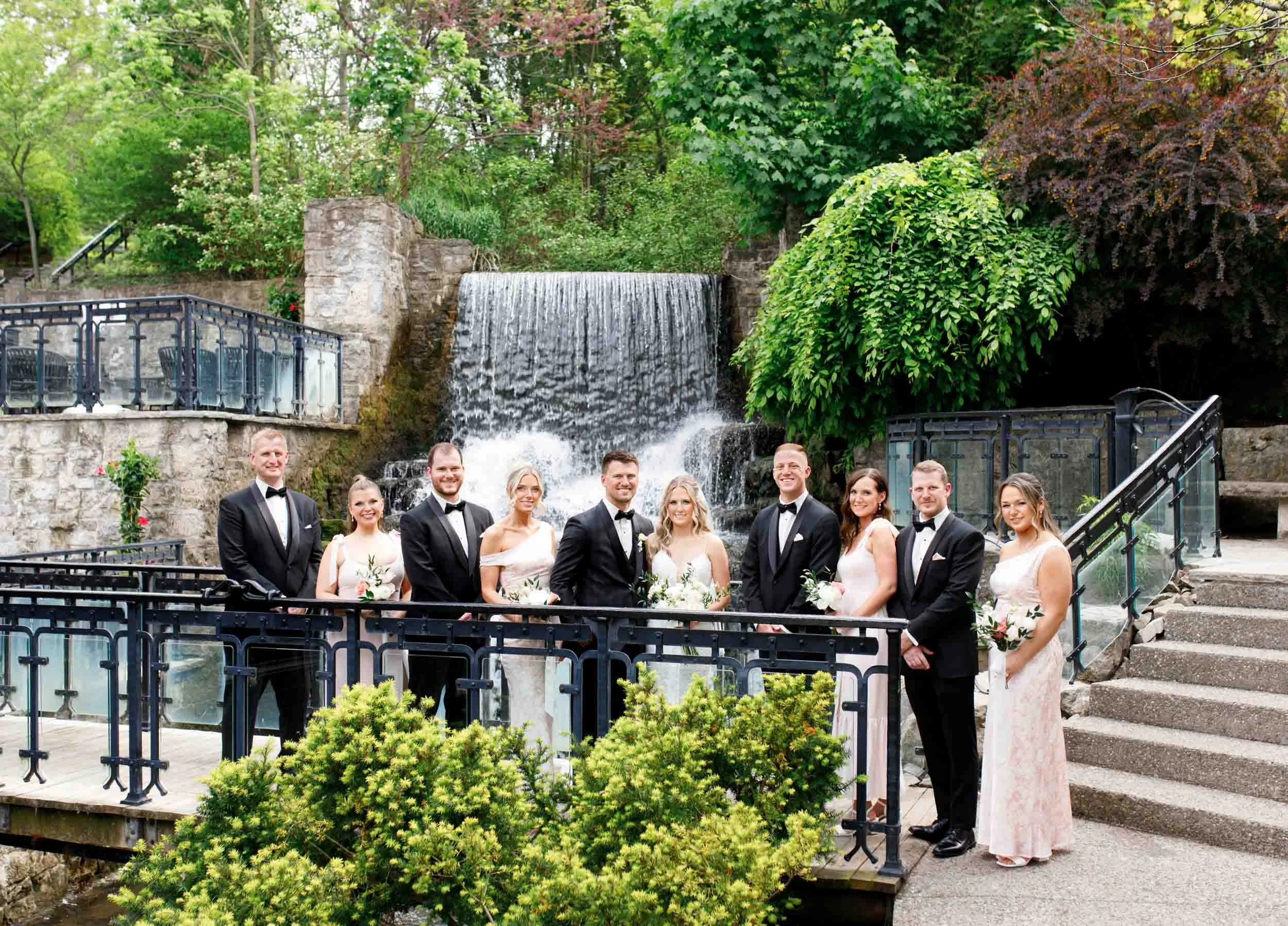 Wedding party portrait at the Ancaster Mill waterfall in Ancaster, Ontario