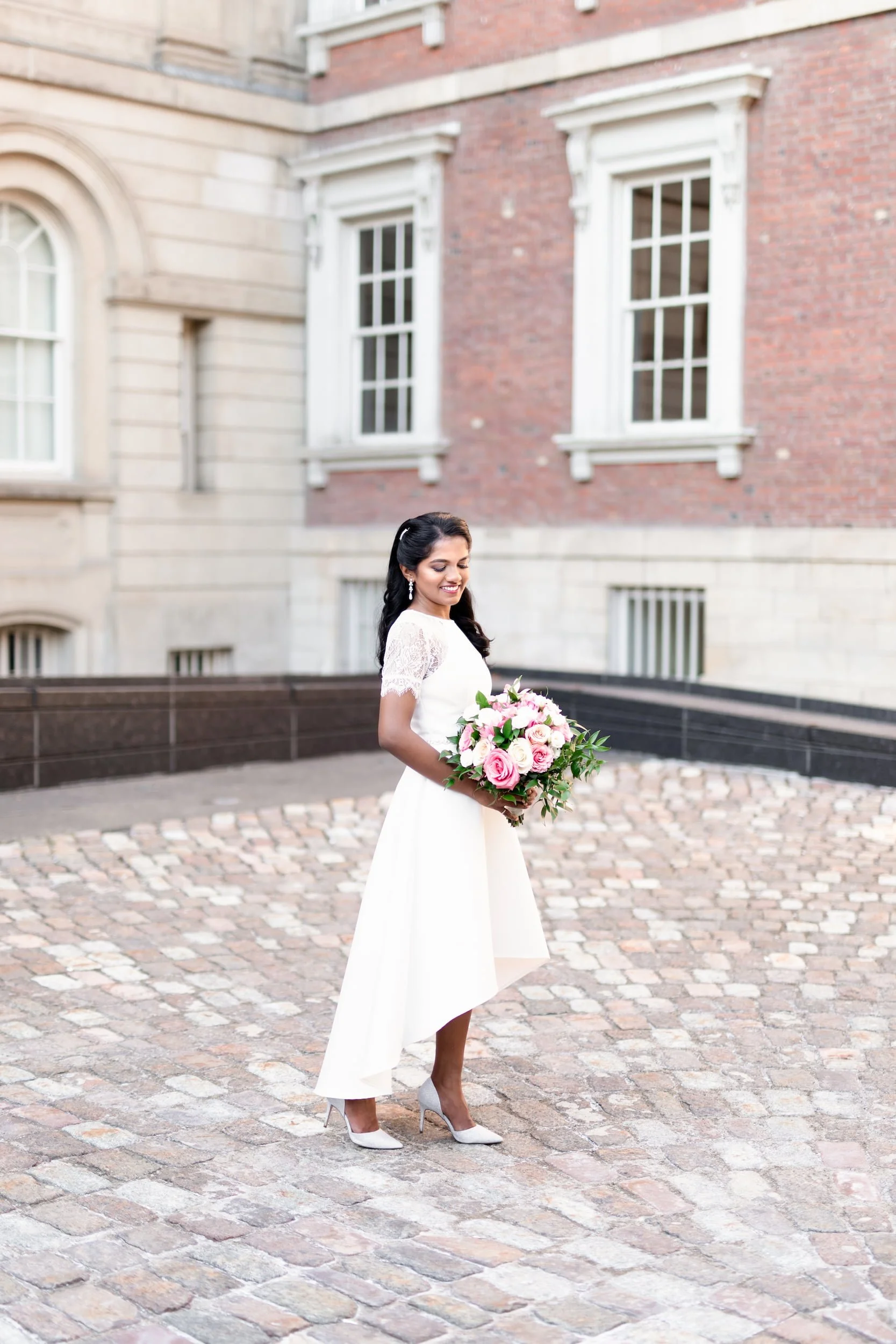 Bridal portrait in cobblestone courtyard at Osgoode Hall in downtown Toronto, Ontario