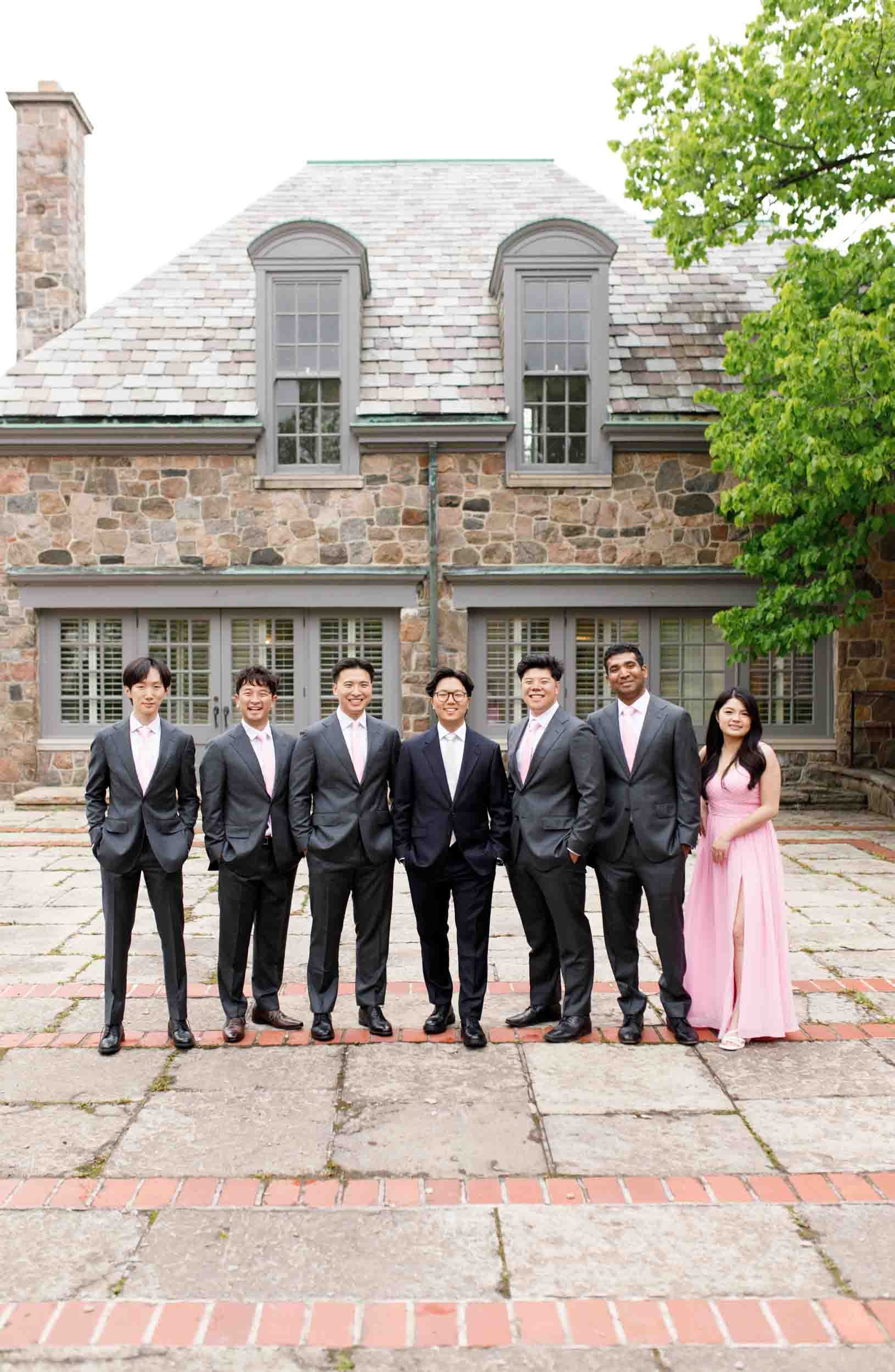 Groomsmen portrait in courtyard at Graydon Hall Manor