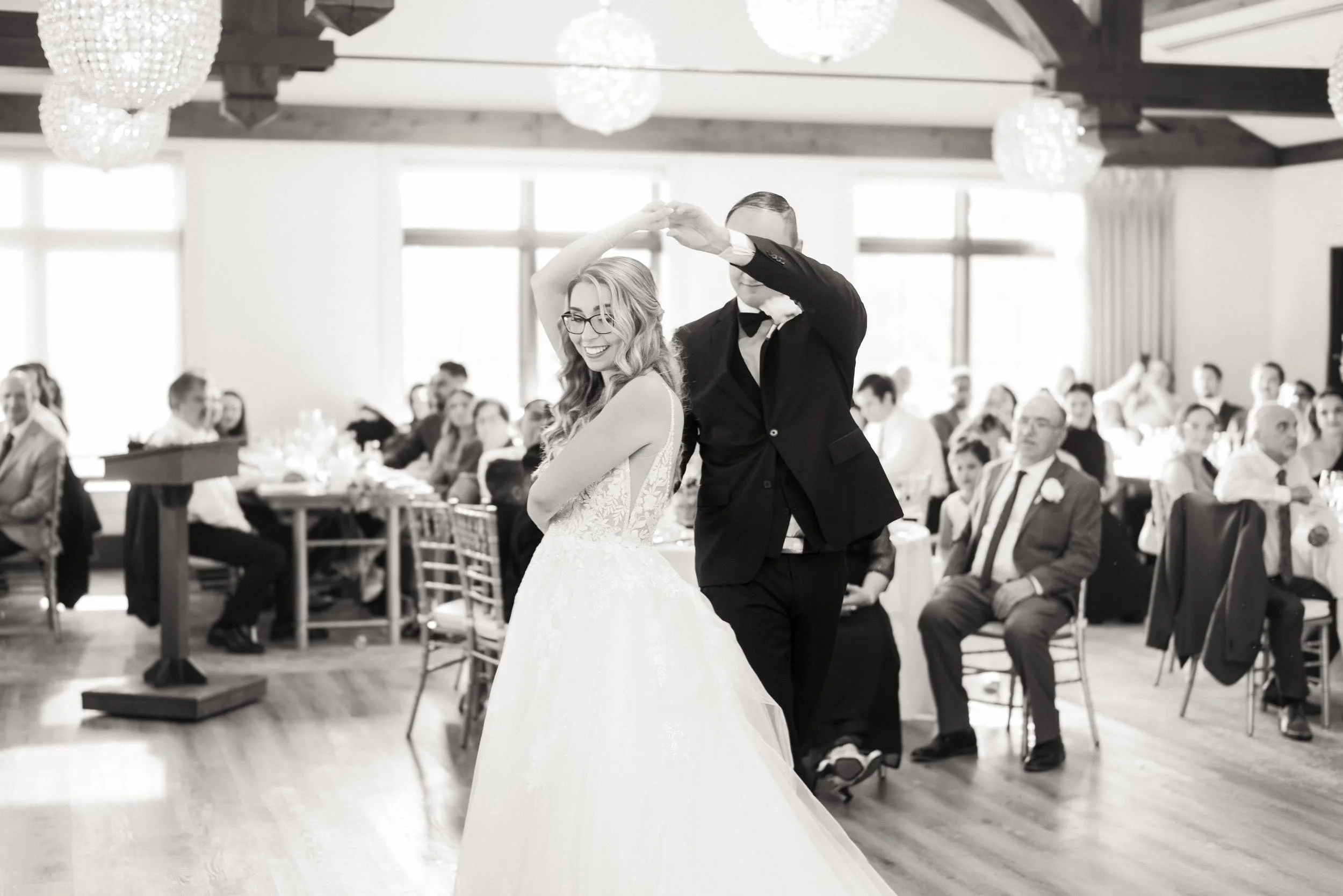 Black and white first dance in reception hall at Whistle Bear Golf Club wedding in Cambridge, Ontario