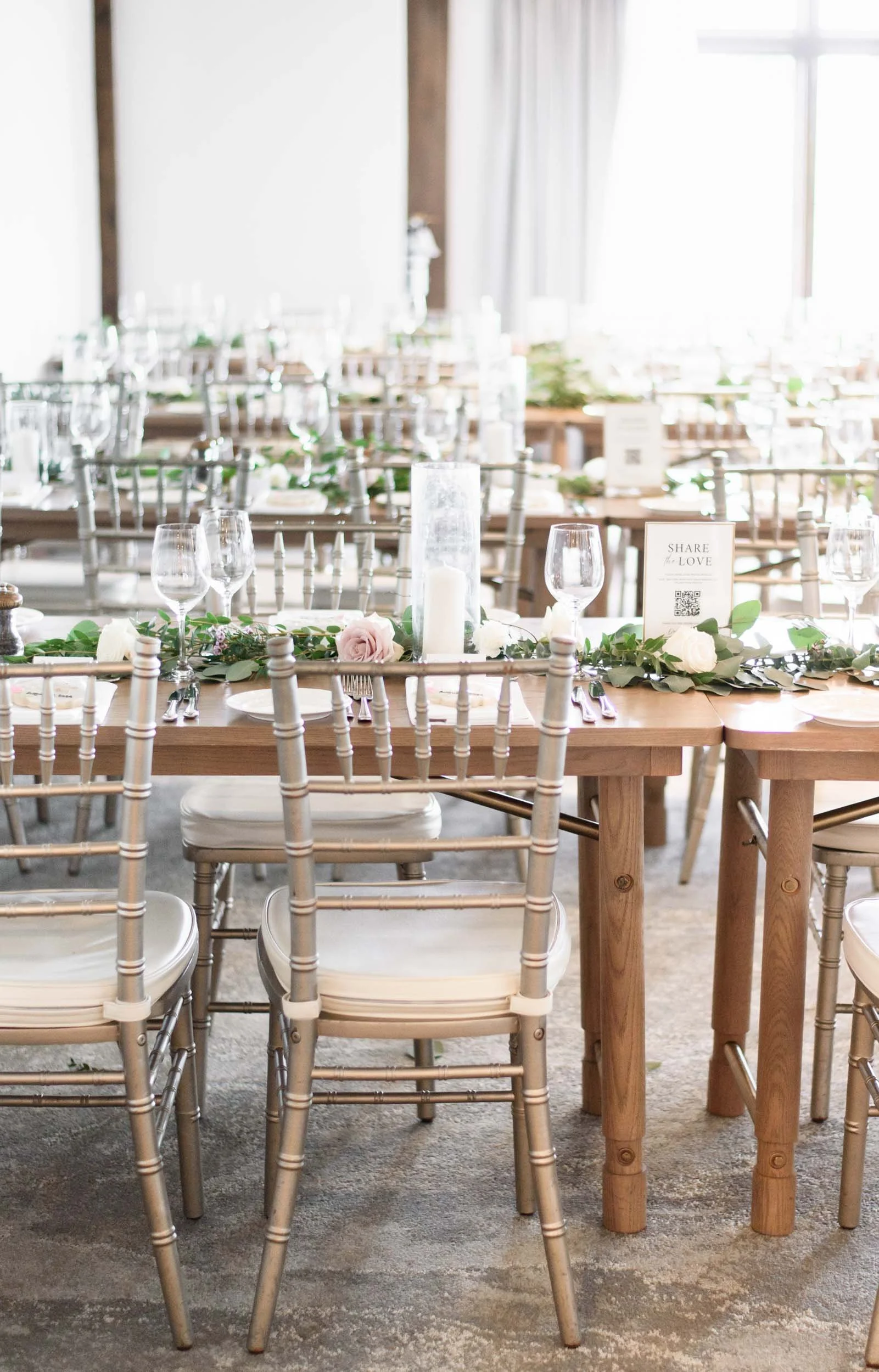 Rustic reception tablescape with wooden harvest tables at Whistle Bear Golf Club wedding in Cambridge, Ontario