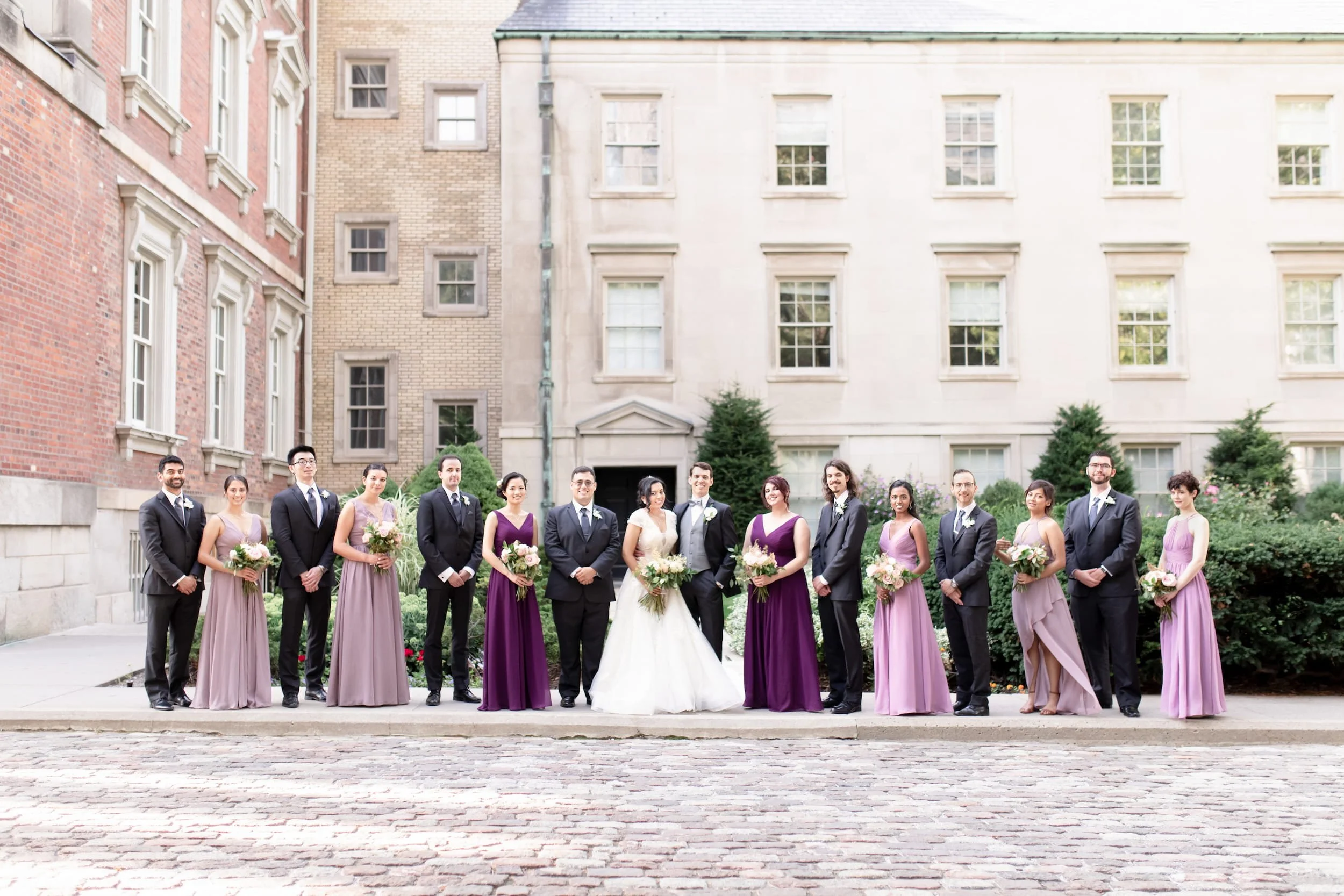 Full wedding party portrait in Osgoode Hall courtyard in downtown Toronto