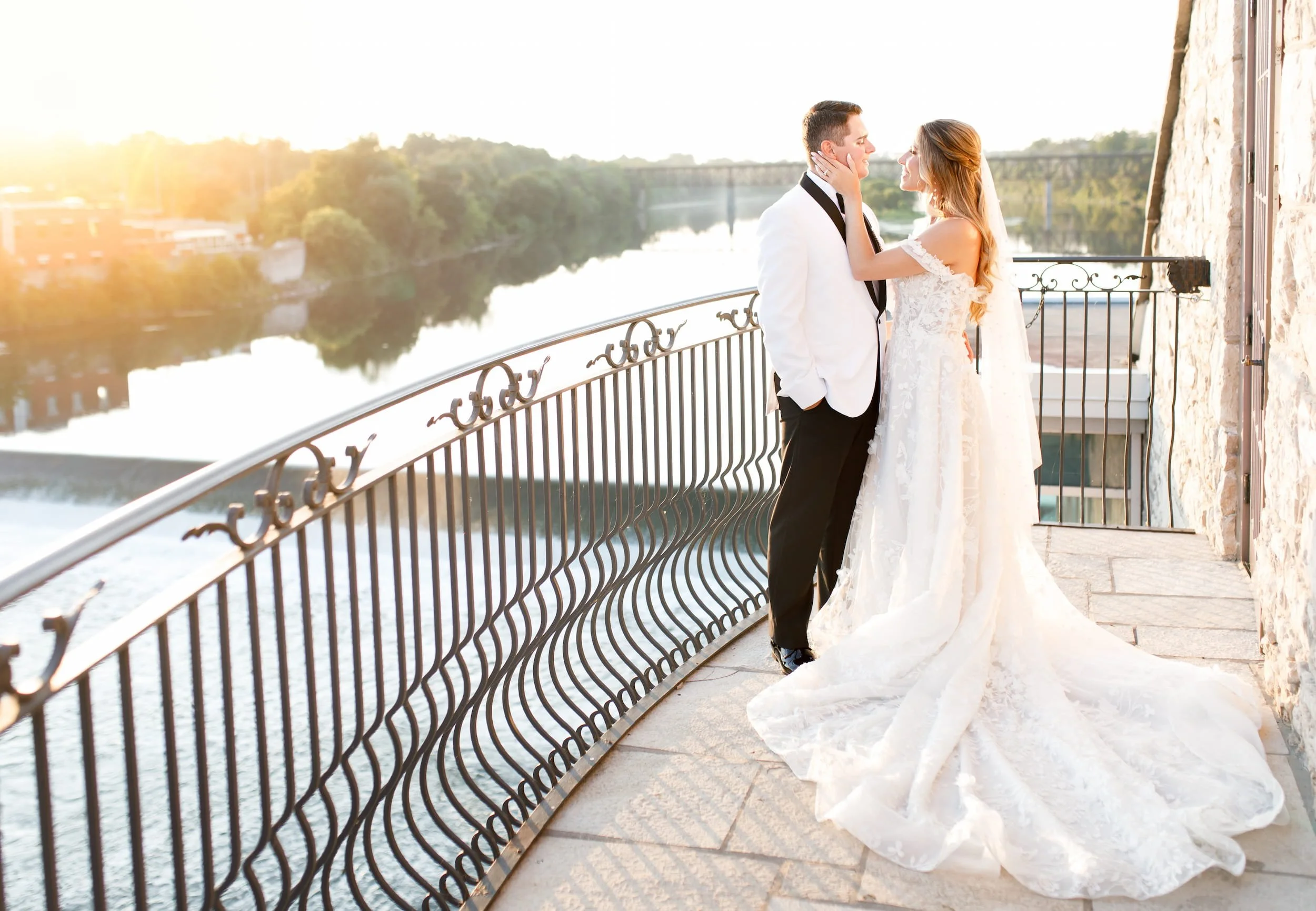 Bride and groom at sunset overlooking the Grand River at Cambridge Mill wedding