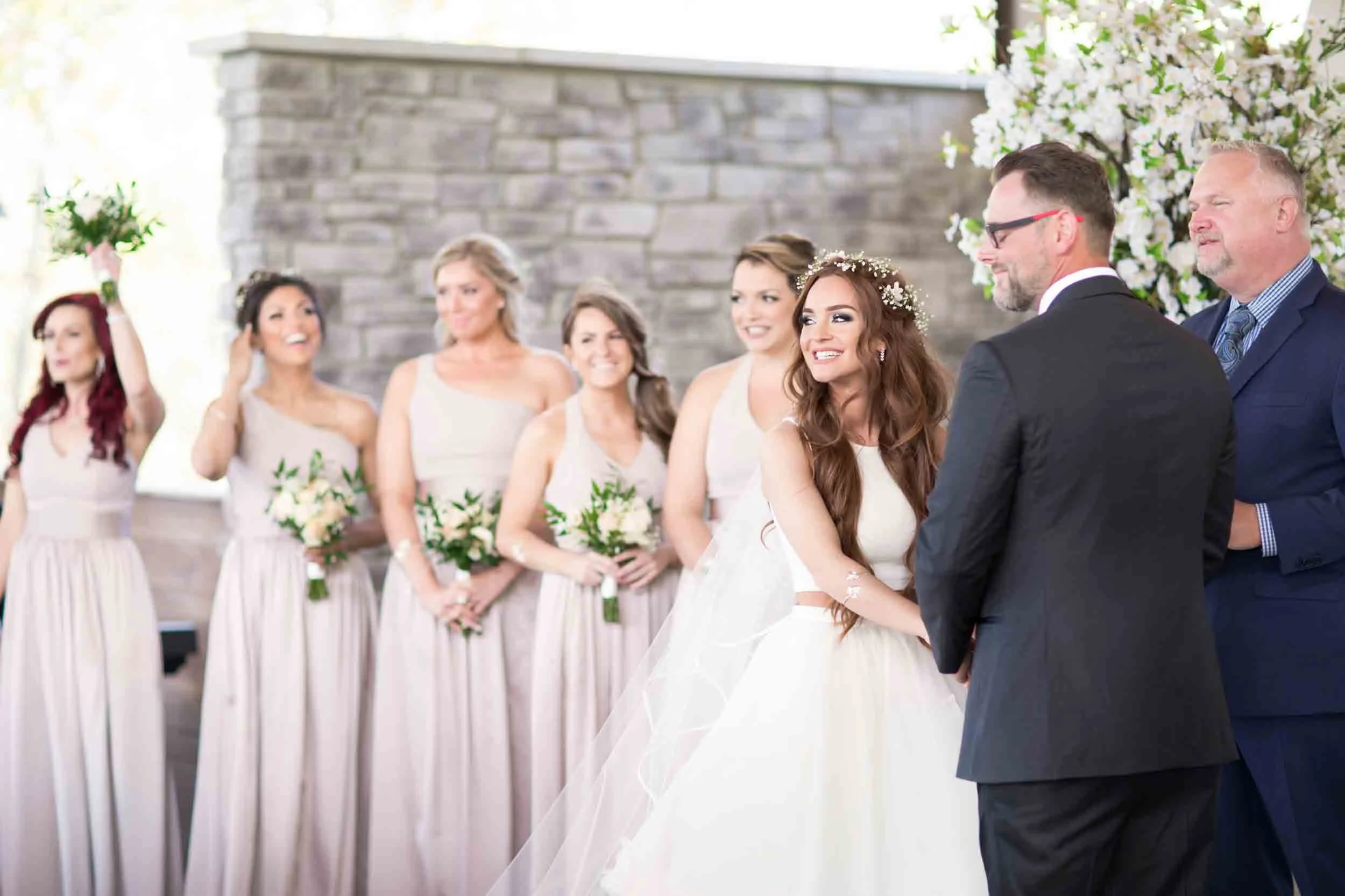 Wedding party ceremony portrait during vows at Guild Inn Estate stone courtyard