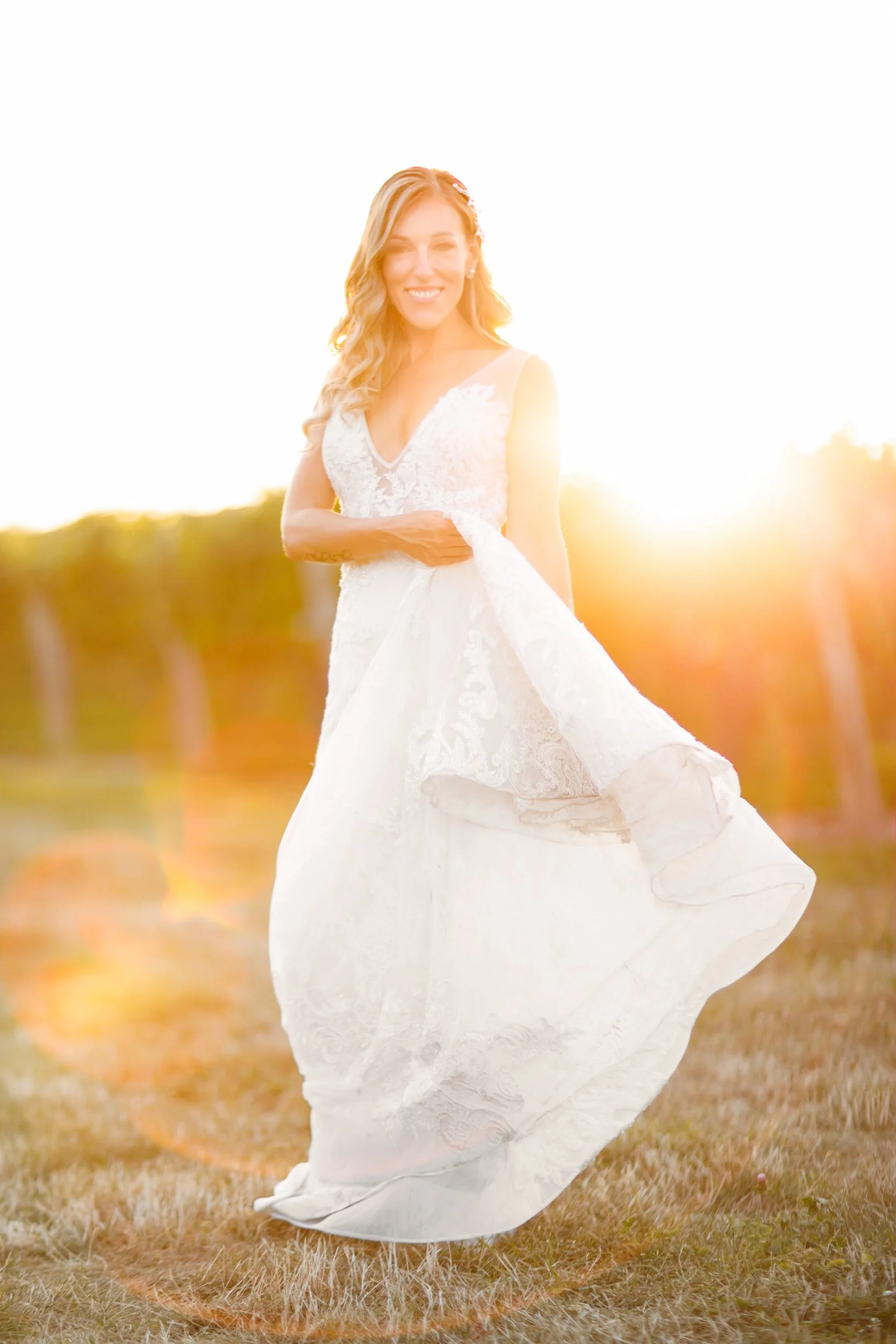 Bride twirling at sunset in Niagara vineyard