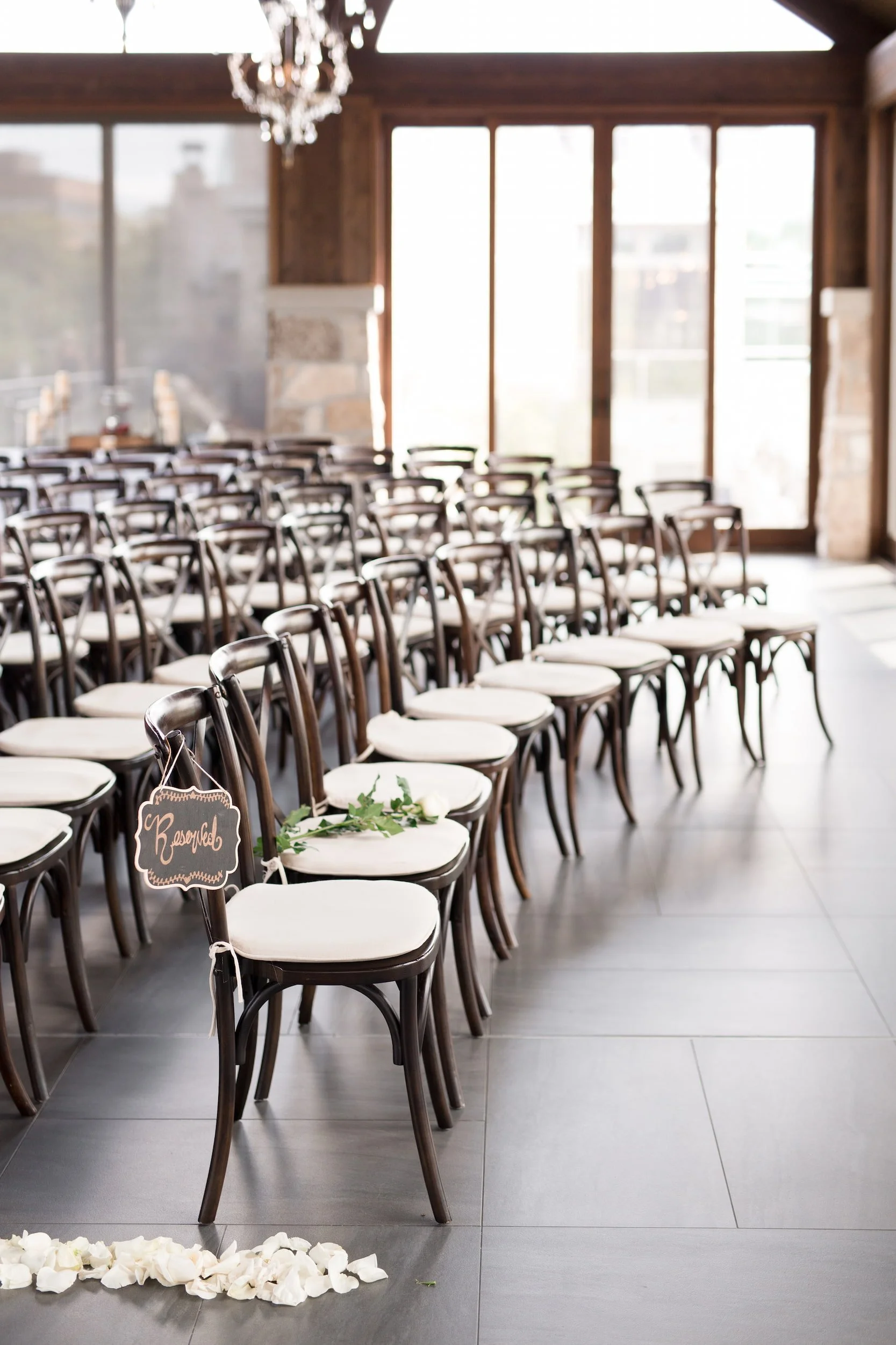 Indoor pavilion ceremony setup with river views at Cambridge Mill in Cambridge, Ontario