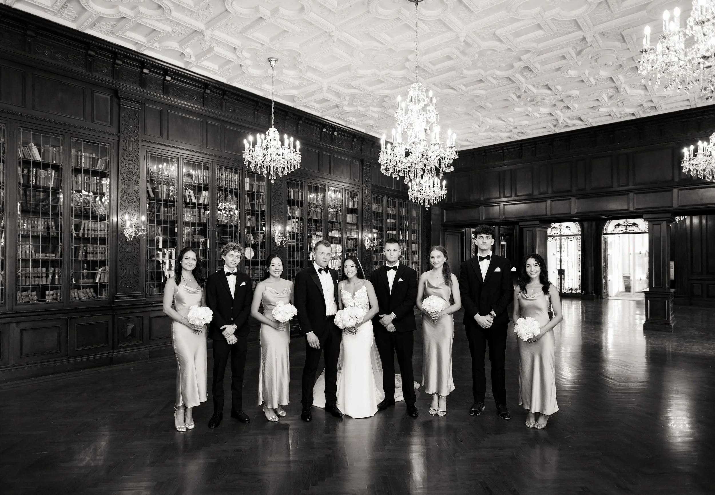 Black and white wedding party portrait in Casa Loma’s Great Hall