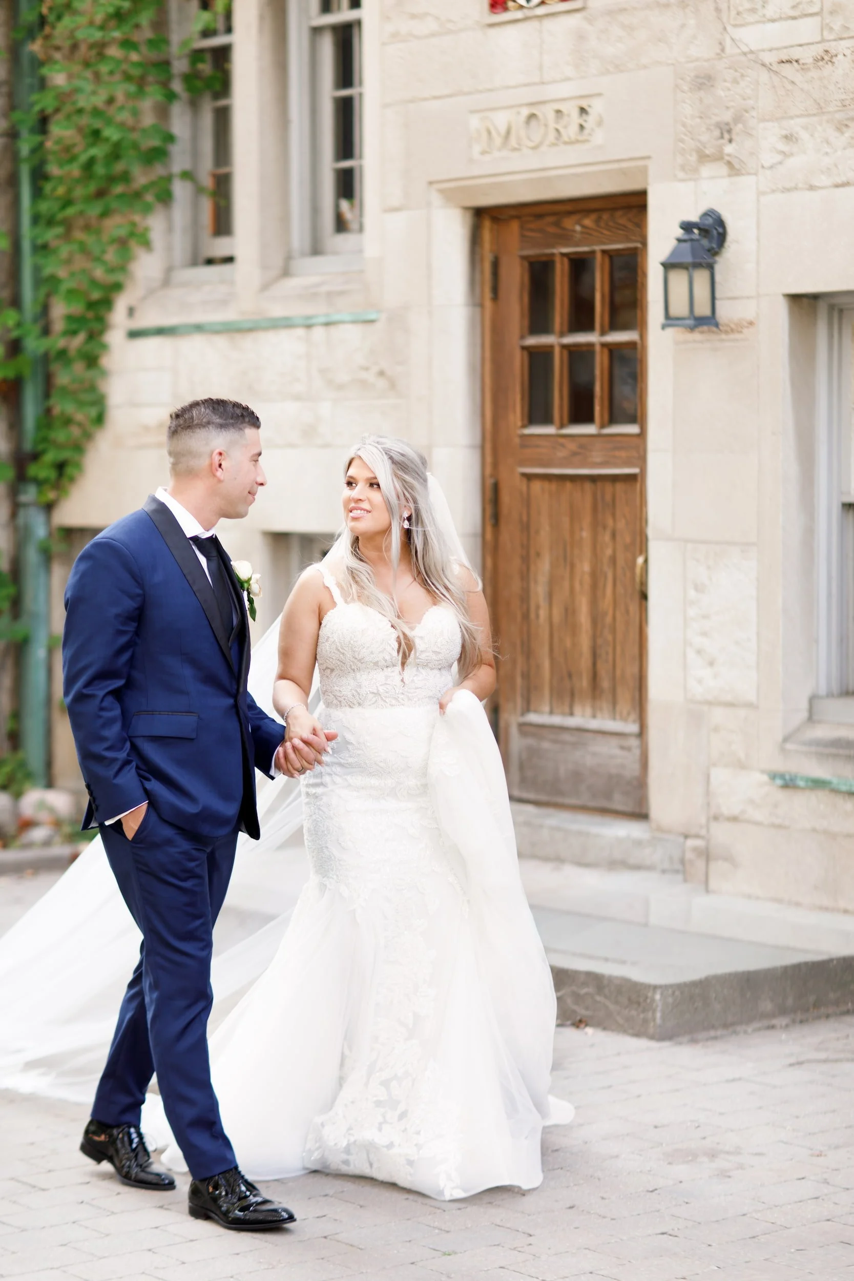 Romantic portrait outside historic residence at St. Michael’s College, University of Toronto in Toronto, Ontario