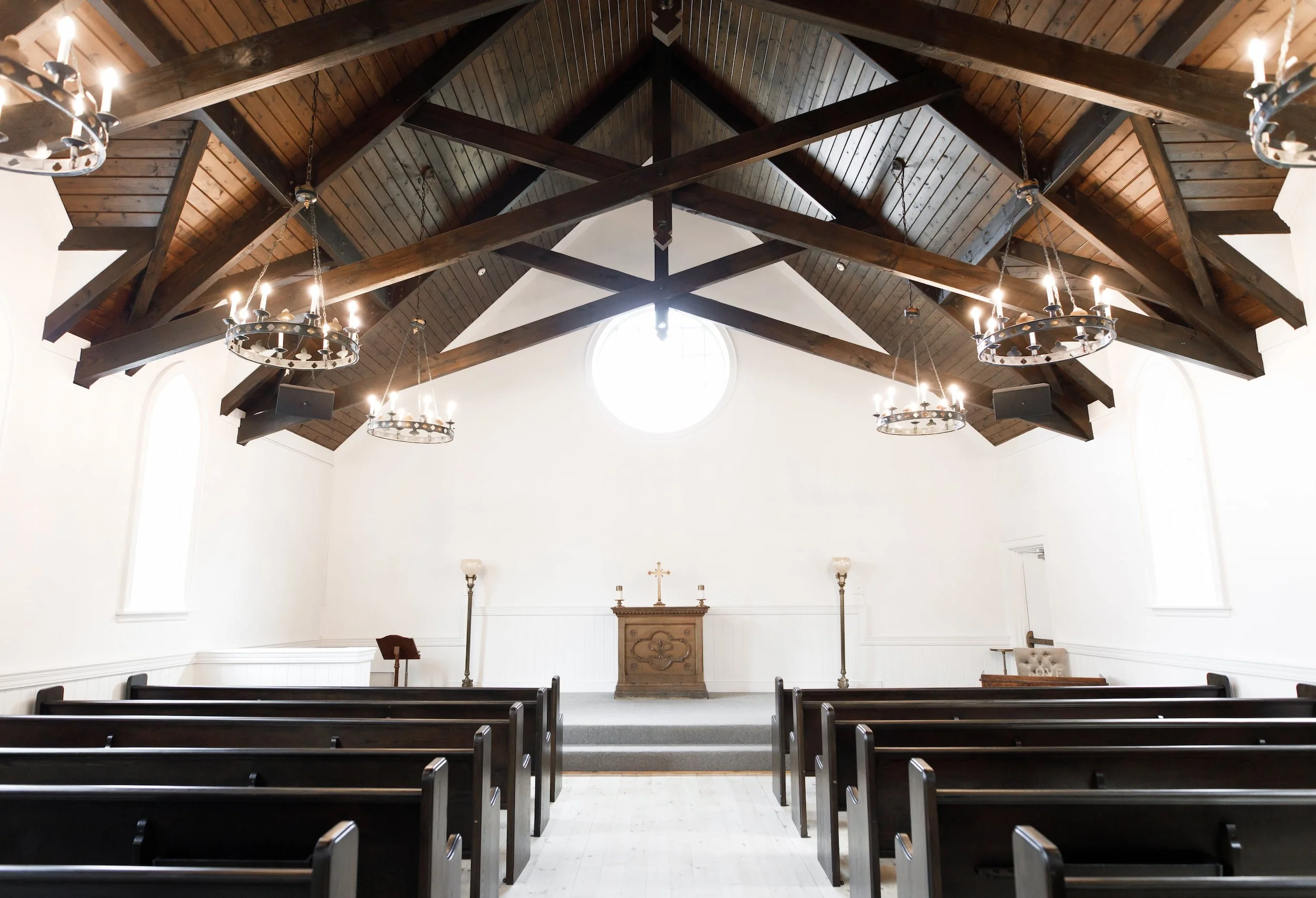 Chapel interior with exposed truss ceiling at The Doctor’s House in Kleinburg, Ontario