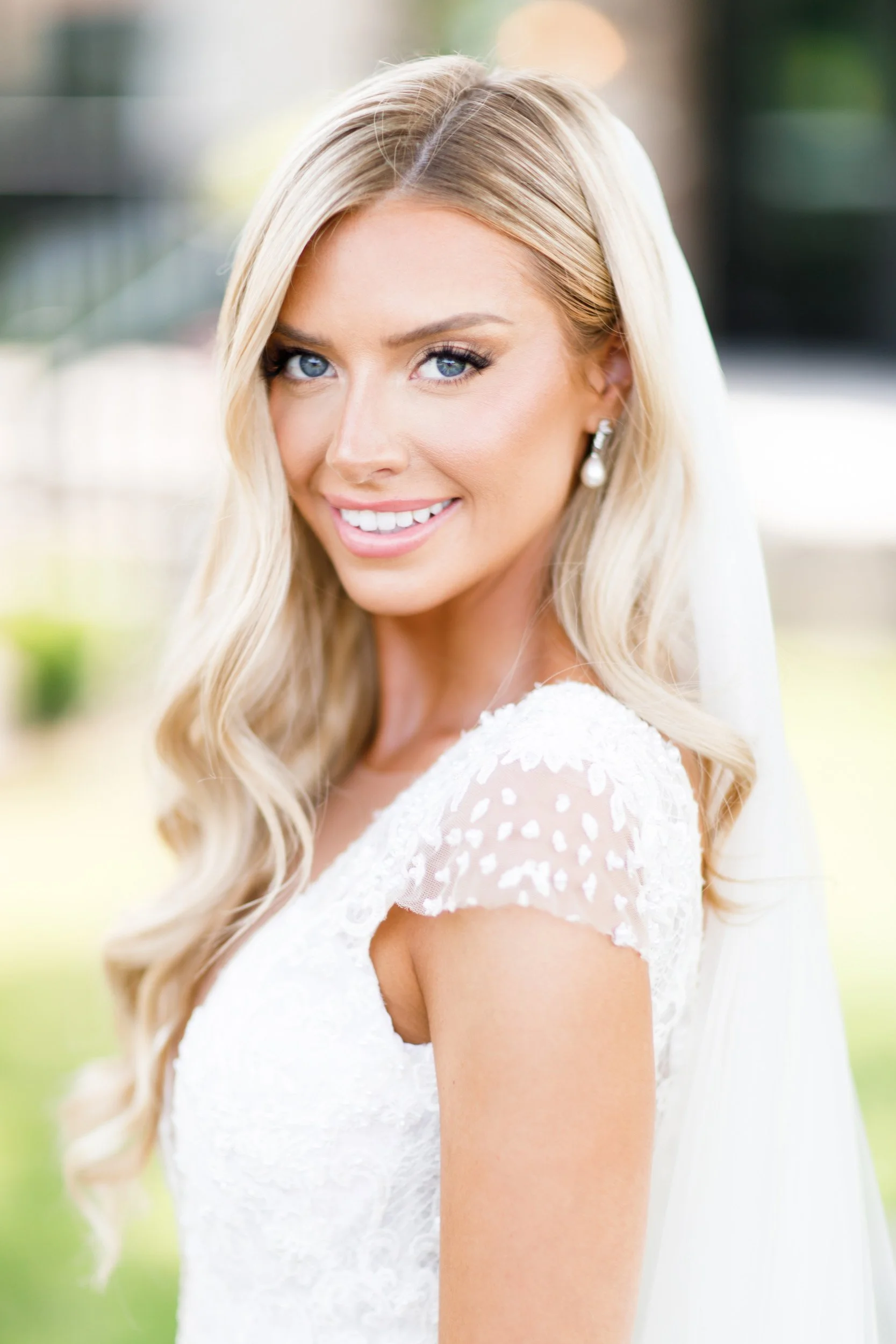 Bride in a lace wedding gown with veil, softly lit outdoor bridal portrait at Roseville Estate in Cambridge, Southern Ontario wedding