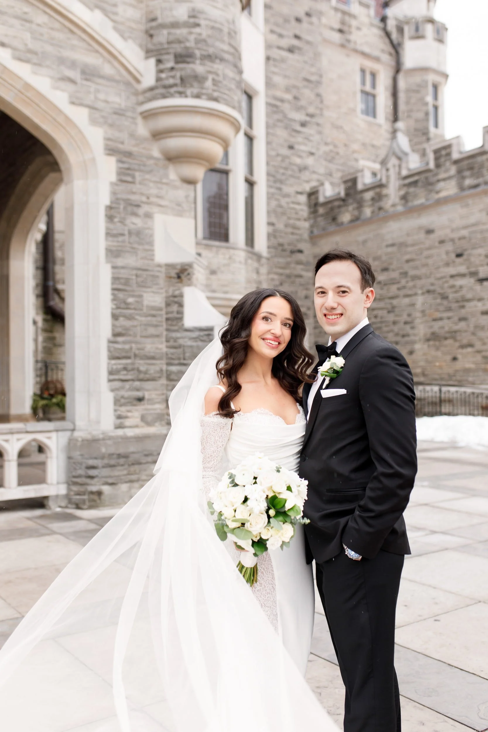 Bride and groom portrait in Casa Loma courtyard