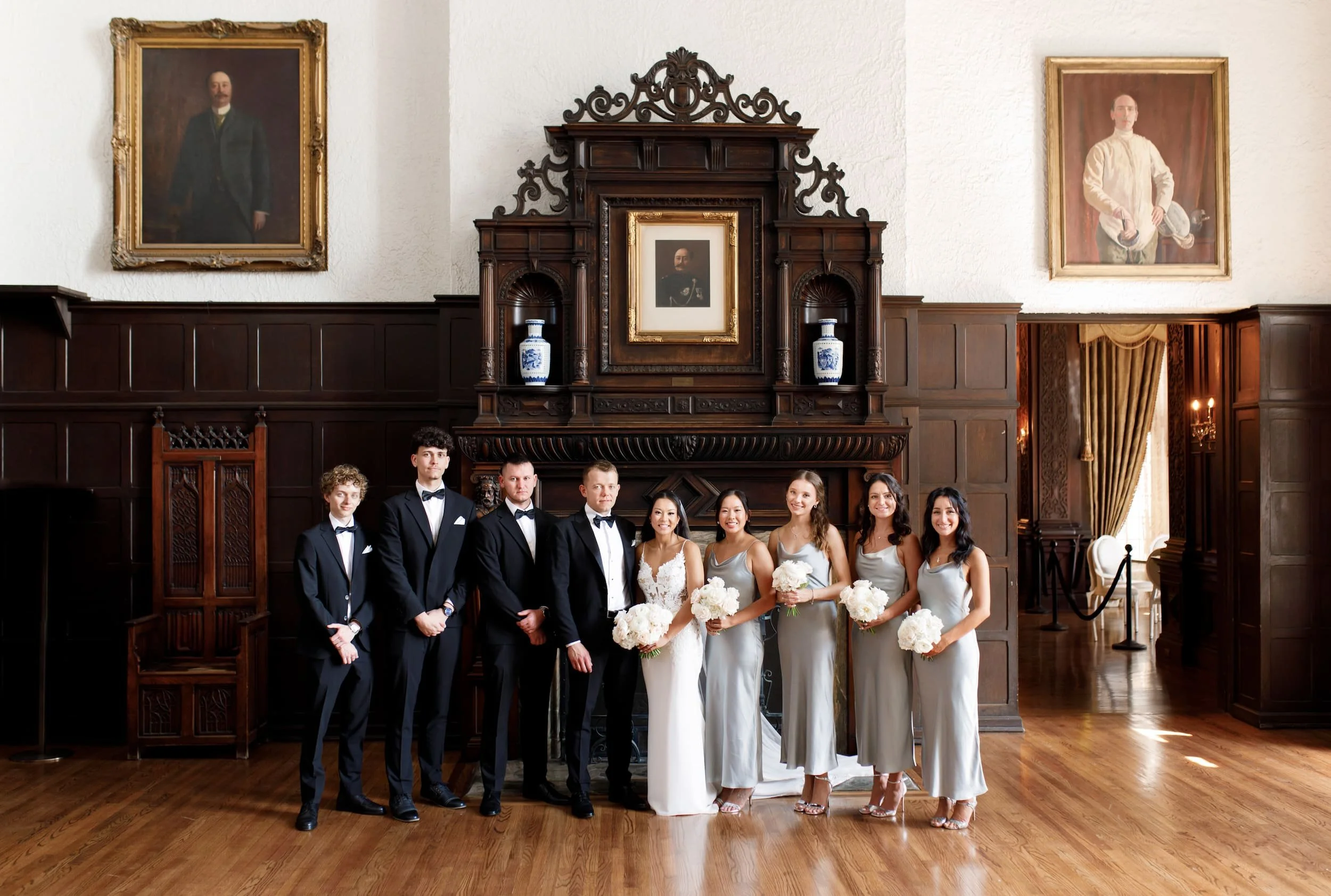 Wedding party portrait inside the Great Hall at Casa Loma