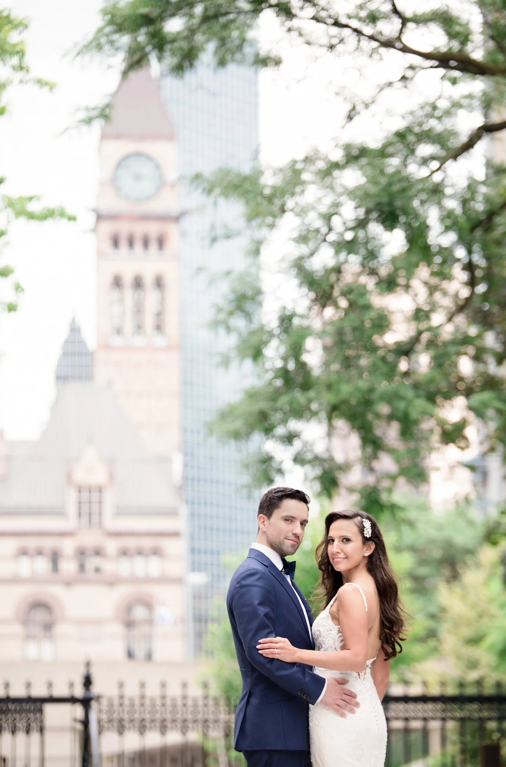 Engagement portrait with Toronto Old City Hall clock tower in background