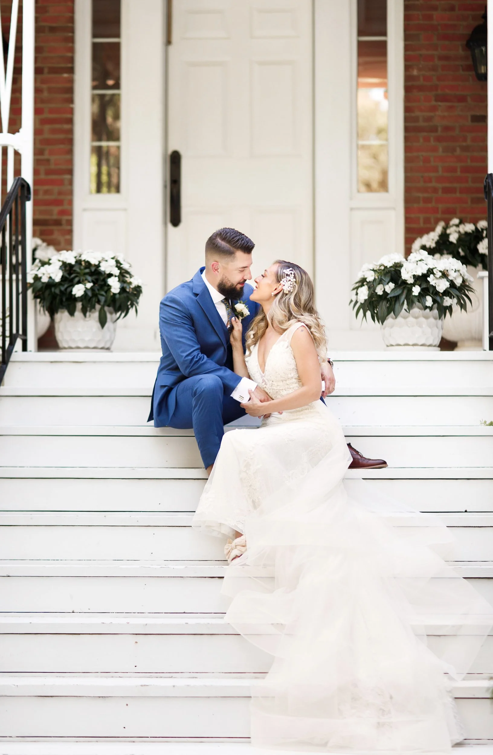 Bride and groom portrait on the steps at Kurtz Orchards in Niagara-on-the-Lake