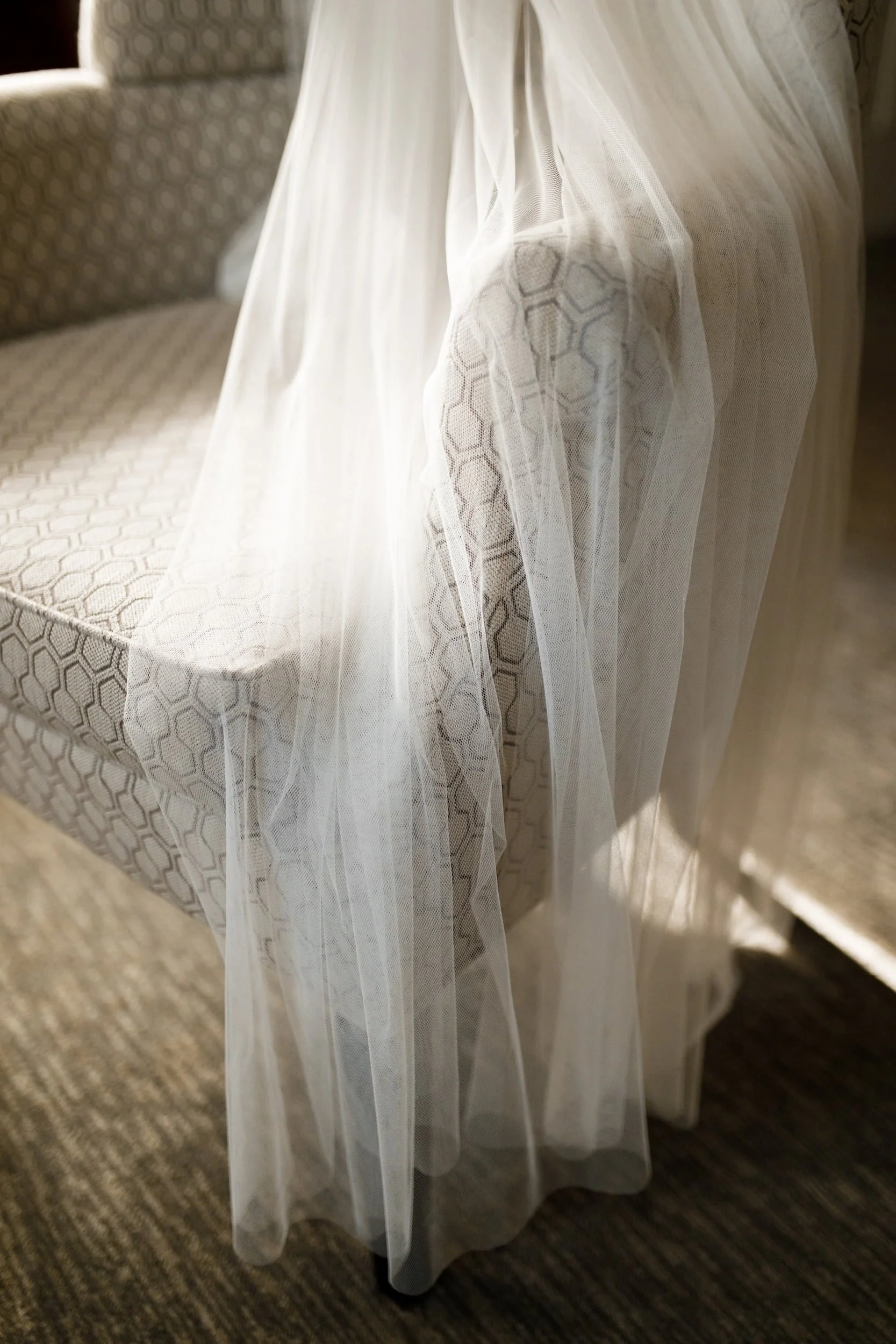 Bride’s lace wedding veil draped over chair in bridal suite at Omni King Edward Hotel Toronto