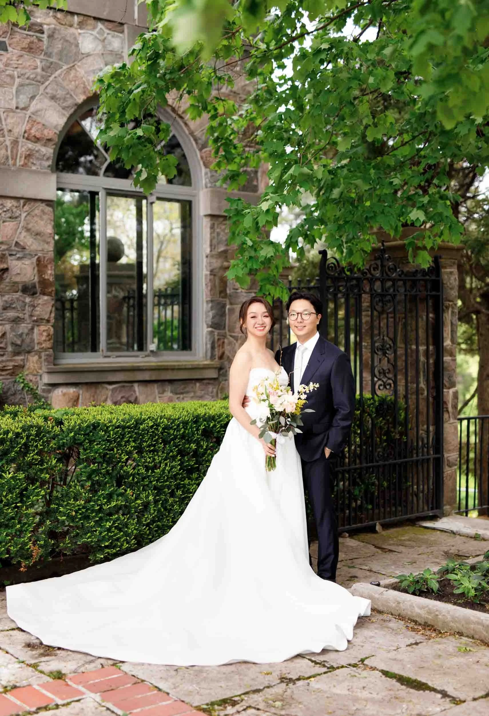 Bride and groom portrait in courtyard at Graydon Hall Manor