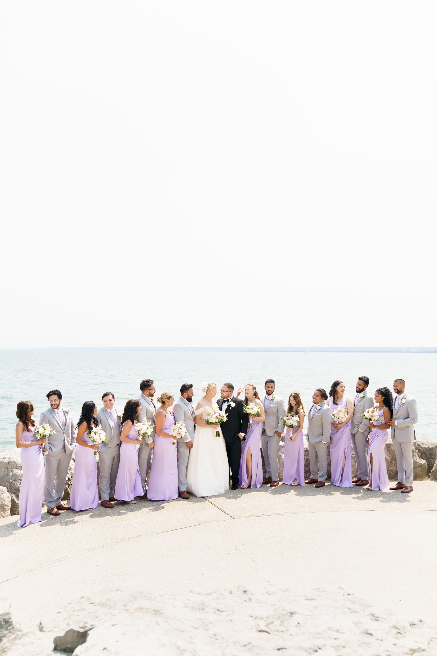 Bridesmaids portrait on Lake Ontario waterfront near The Pearle Hotel in Burlington