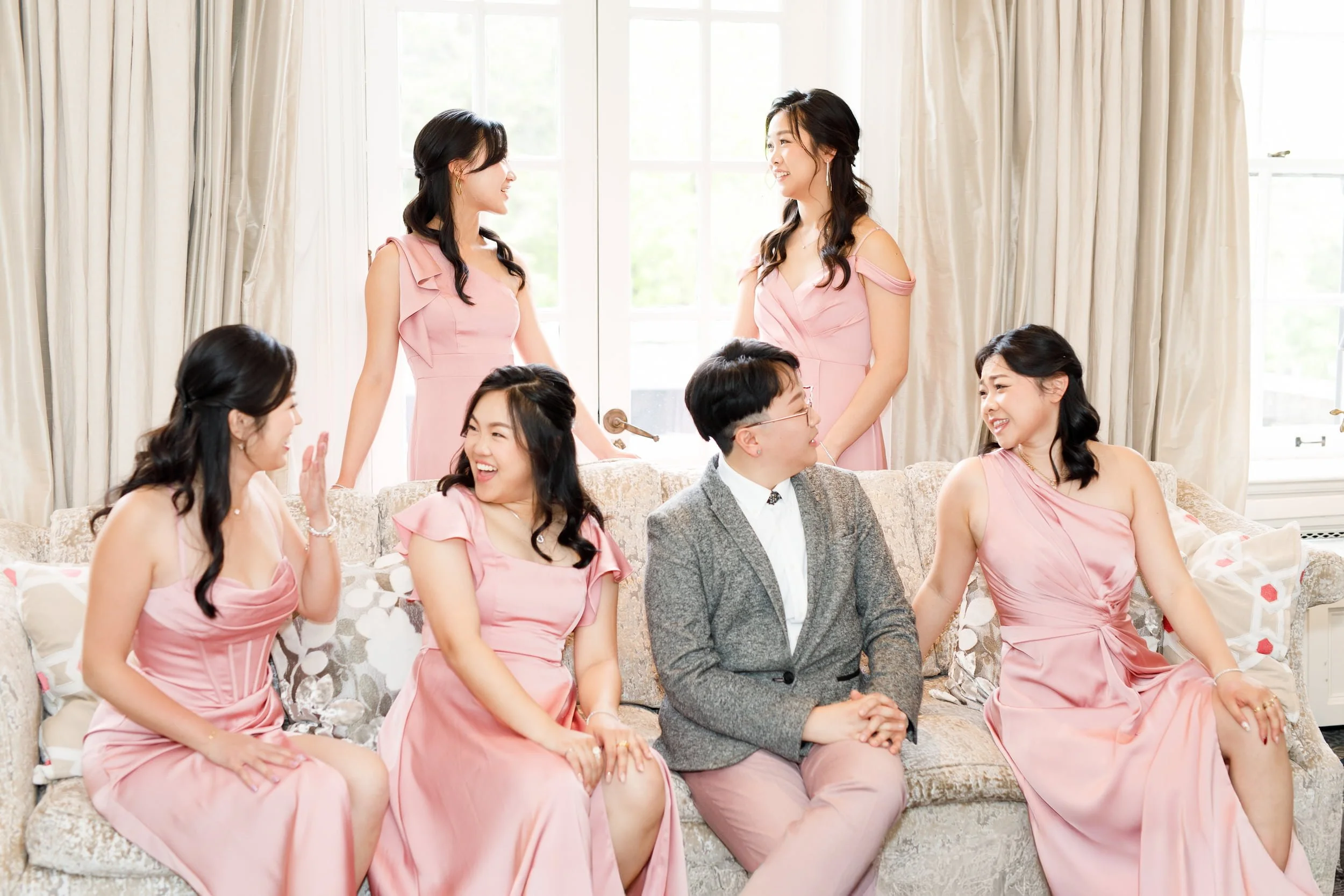 Wedding party candid moment in bridal suite at Graydon Hall Manor