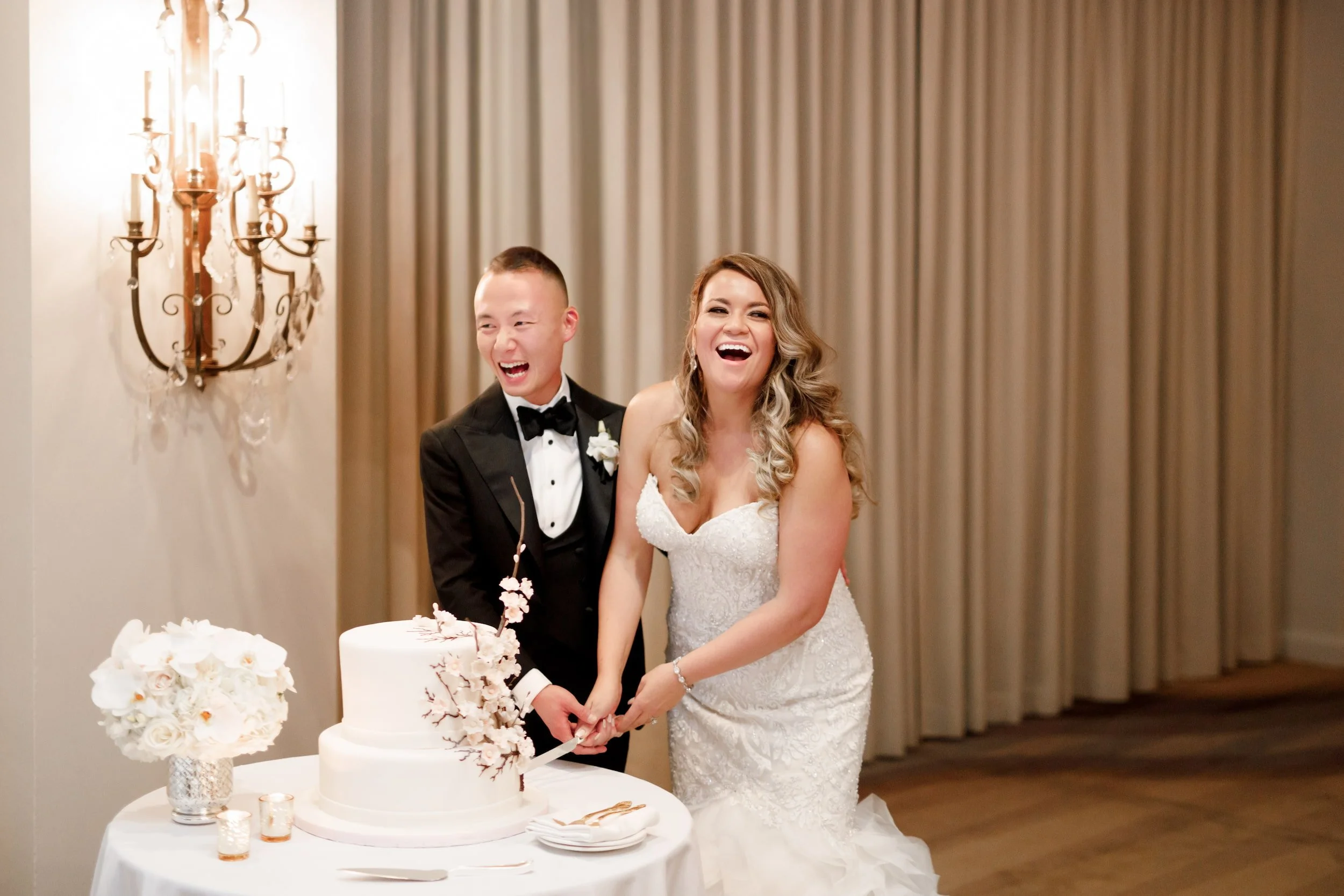 Wedding cake cutting in the Vanity Fair Ballroom at Omni King Edward Hotel