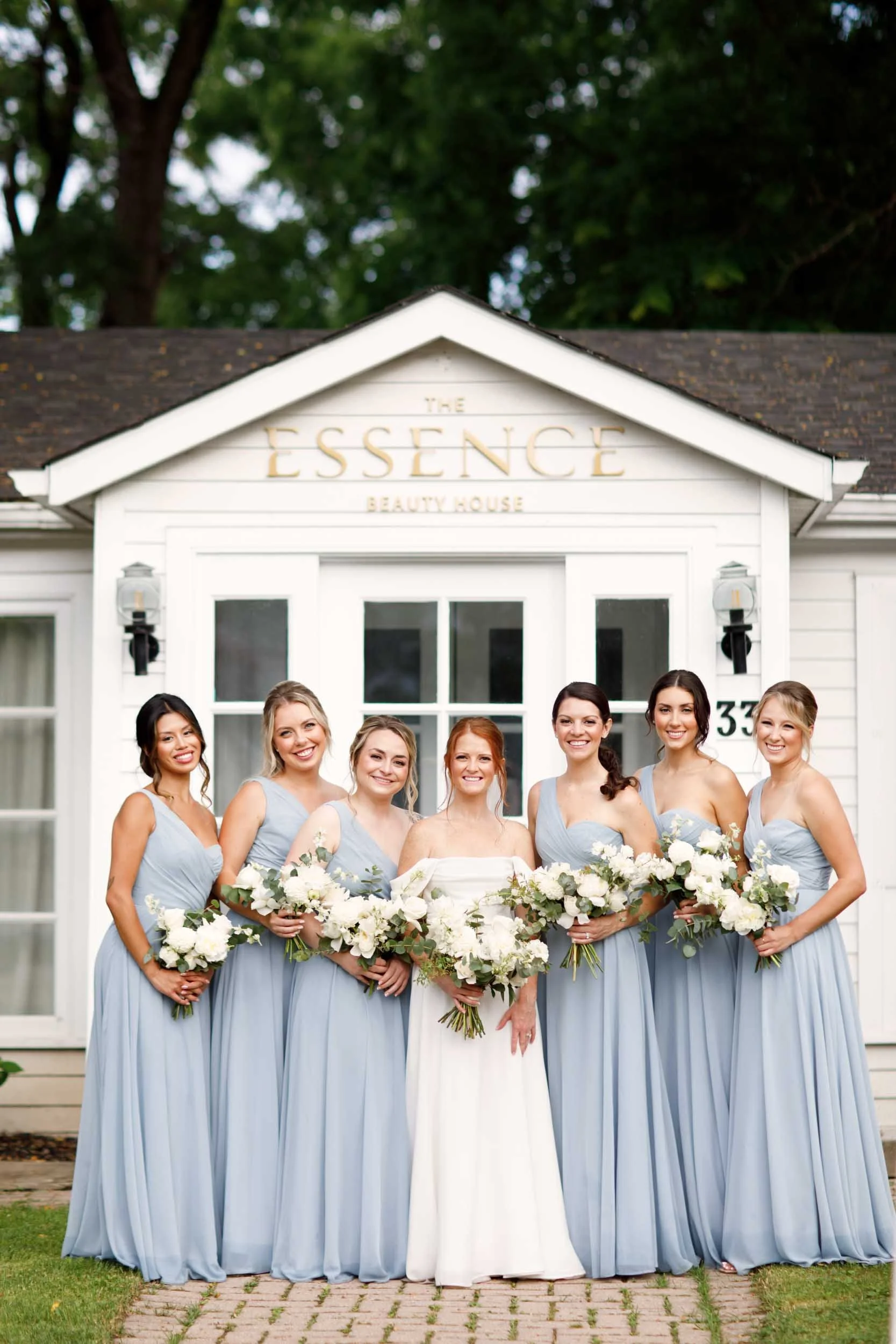 Bridal party portrait in front of The Essence Event Venue at The Doctor’s House in Kleinburg, Ontario