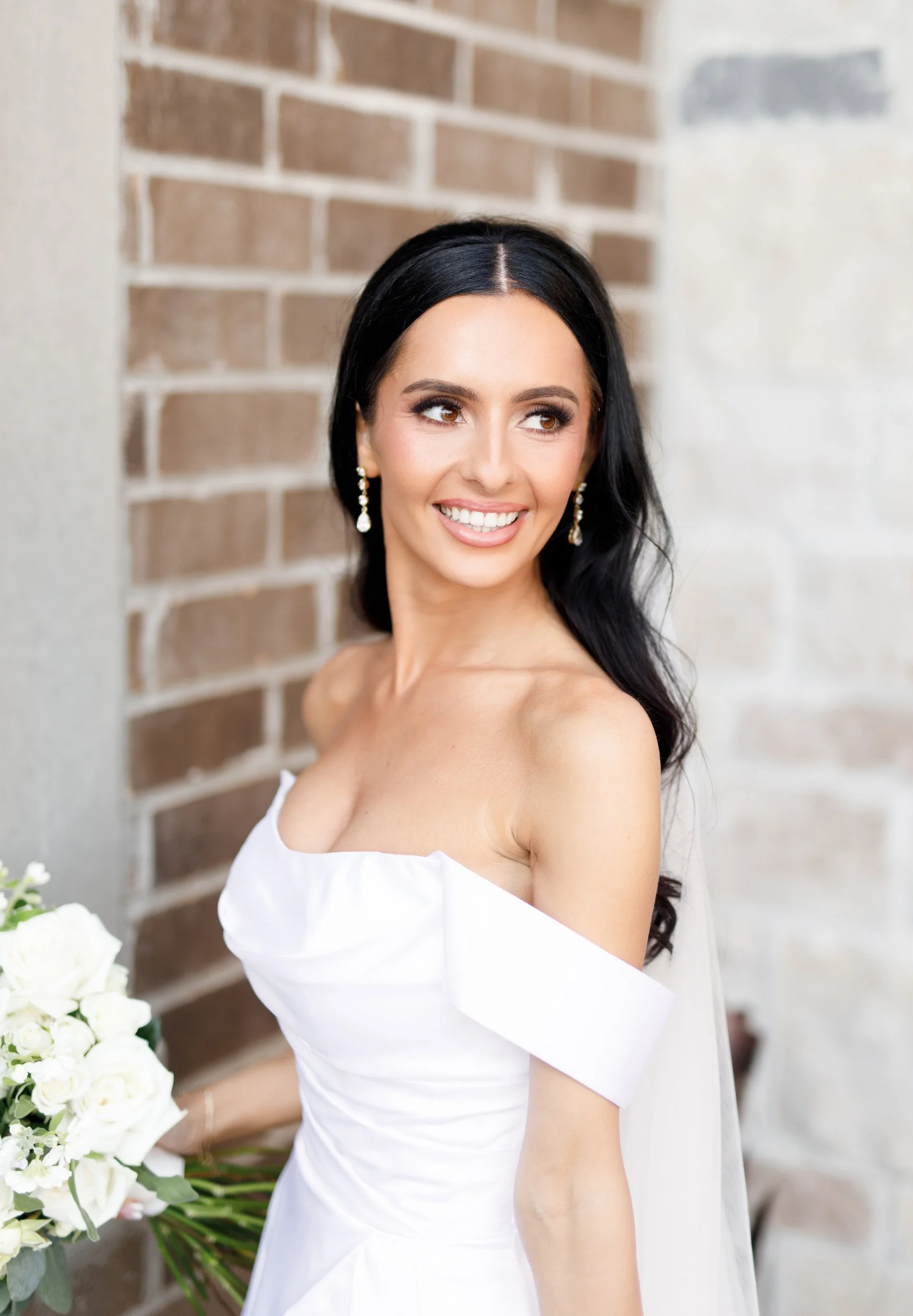 Bridal portrait against the Arlington Estate stone wall in Vaughan