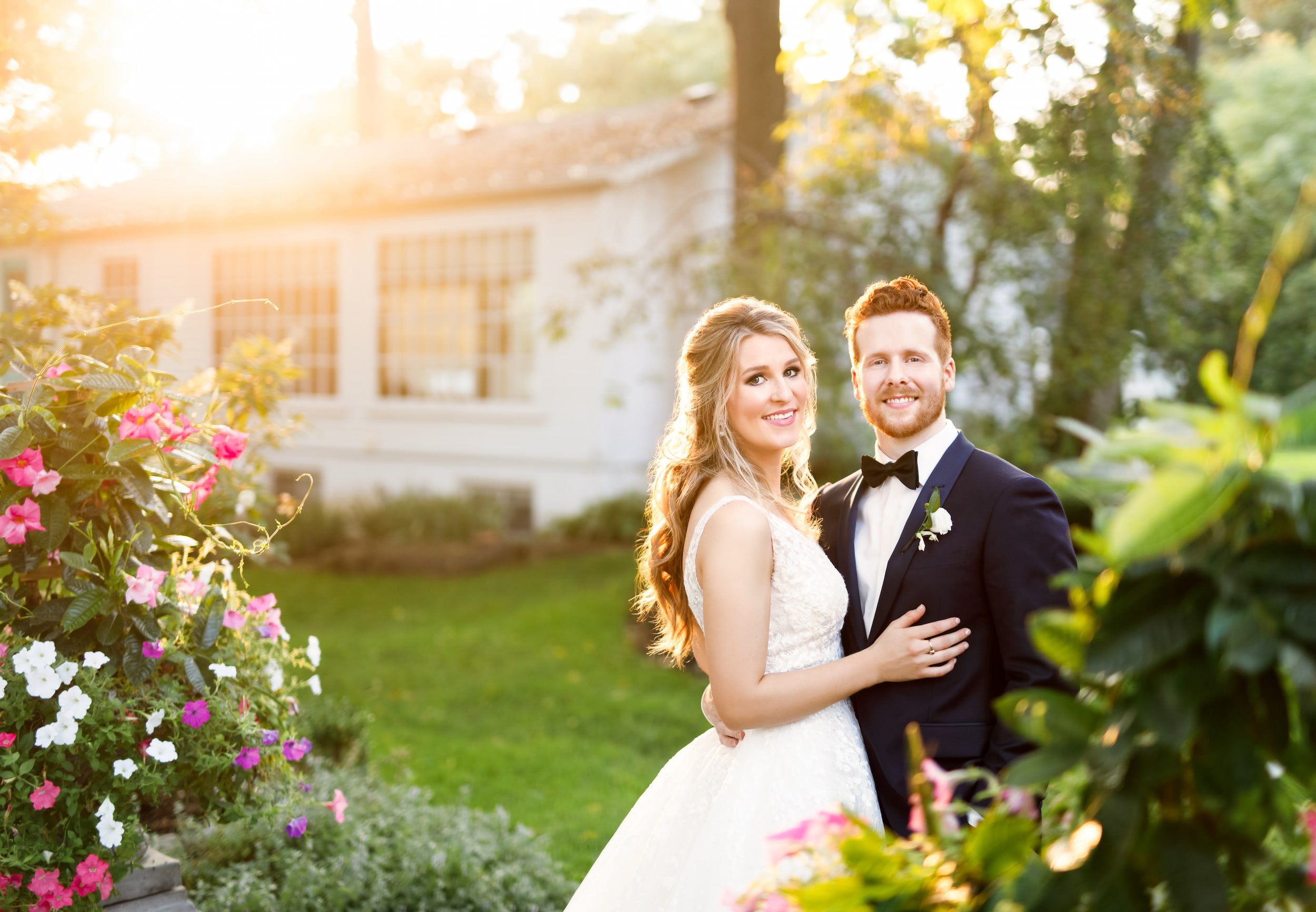 Bride and groom posing together during golden hour wedding portraits